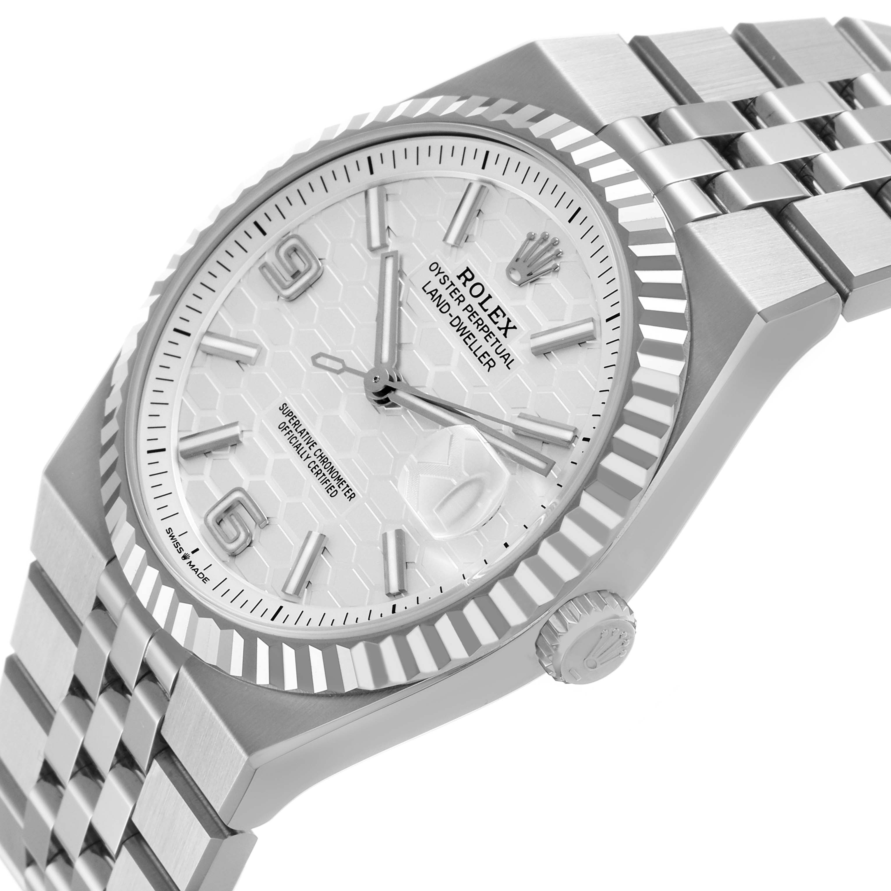The Rolex Land-Dweller watch is viewed from a slightly angled side, showing the dial, bezel, crown, and part of the bracelet.