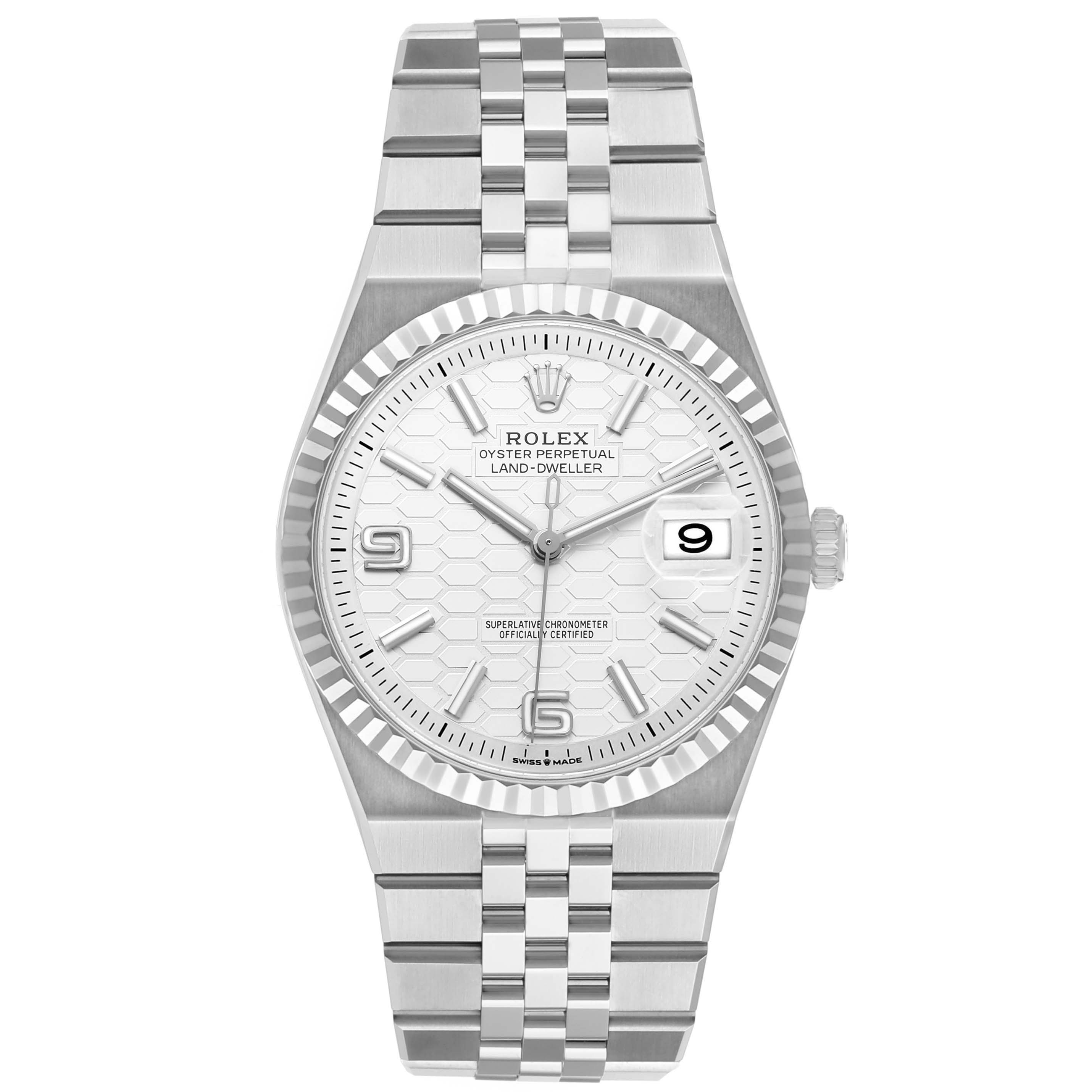The Rolex Land-Dweller watch is shown from a front angle, highlighting the dial, bezel, case, and bracelet.