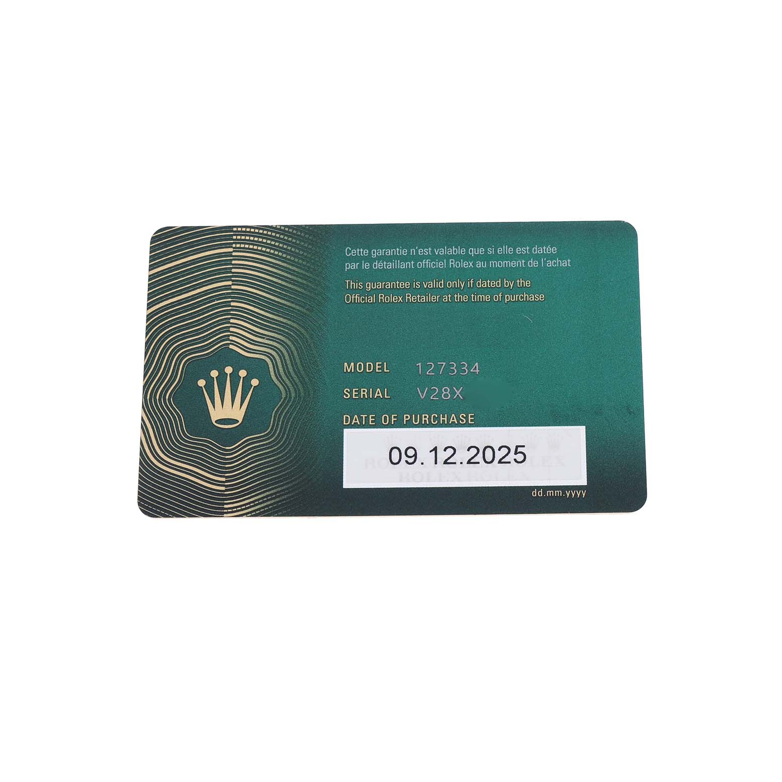 The image shows a warranty card for the Rolex Land‑Dweller 127334 Men's Steel and Gold (two tone) White Dial model, displaying model, serial number, and purchase date.