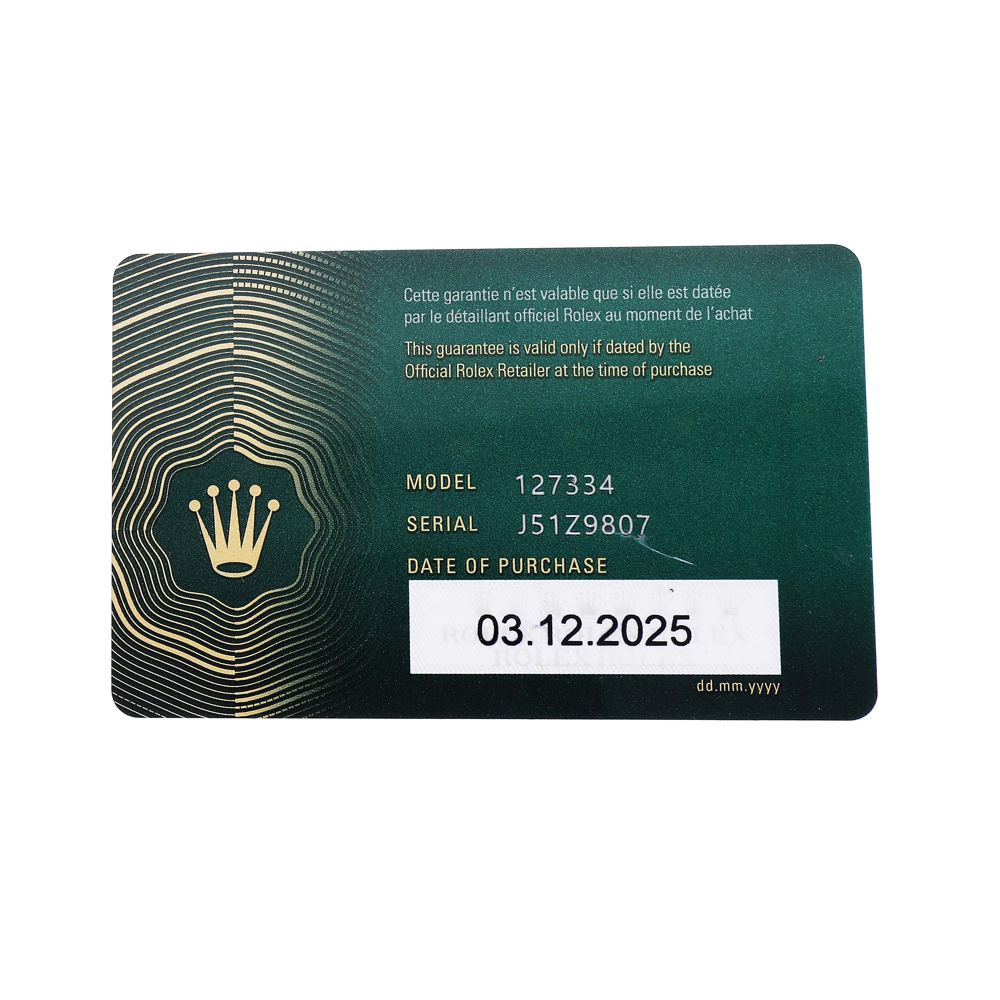 The image shows a warranty card for a Rolex Land‑Dweller 127334 Men's Stainless Steel White Dial watch, displaying model, serial number, and purchase date details.