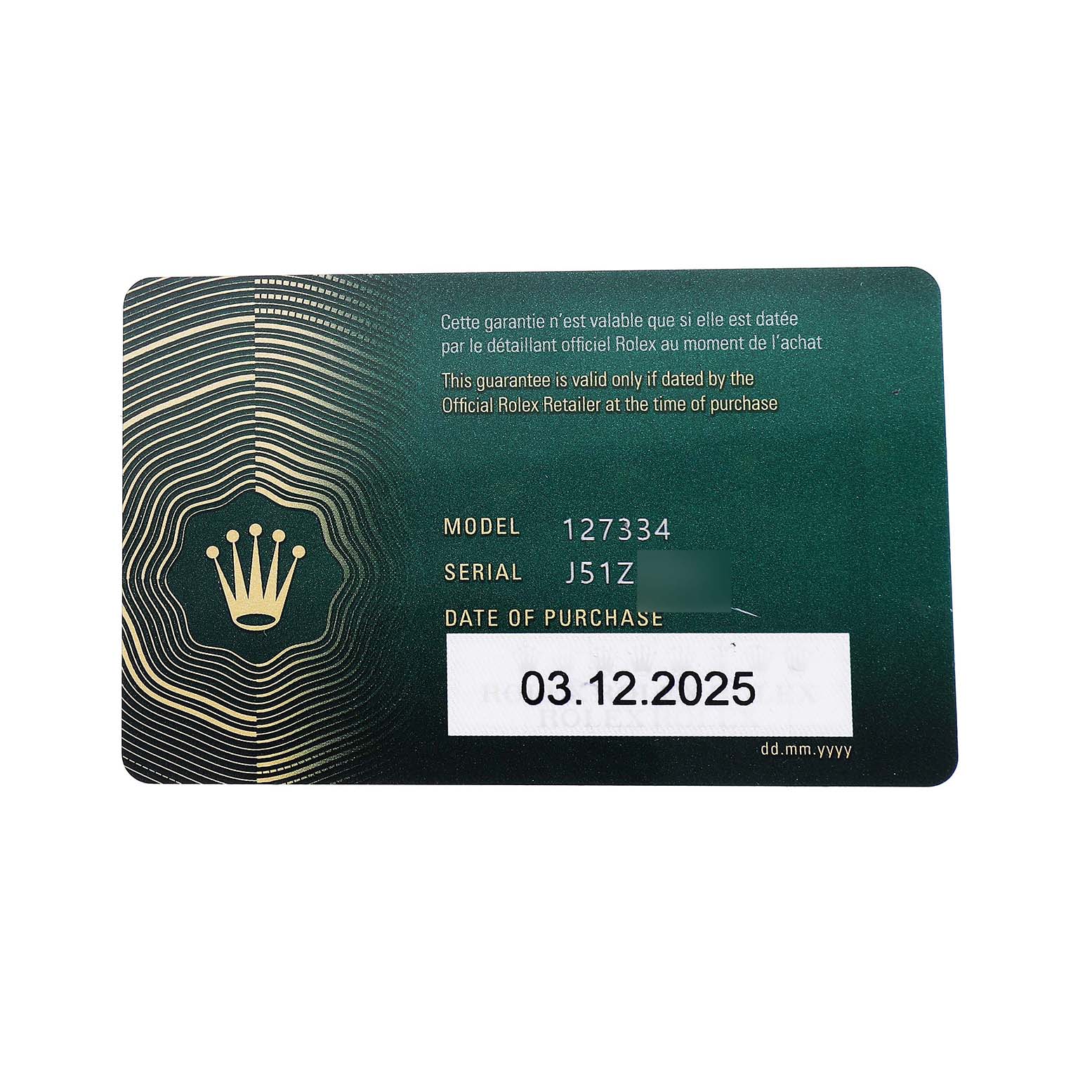 The image shows a Rolex Land-Dweller warranty card with model and serial numbers visible.