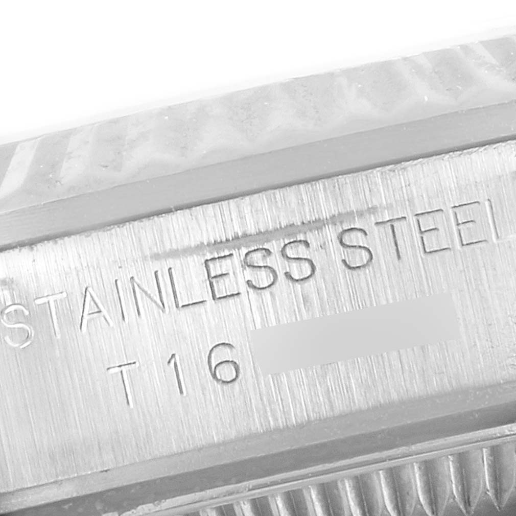 The image shows a close-up of the case side of a Rolex Oyster Perpetual 67194 Women's Stainless Steel Silver Dial 67194 Women's Stainless Steel Silver Dial watch, highlighting the "Stainless Steel" engraving.