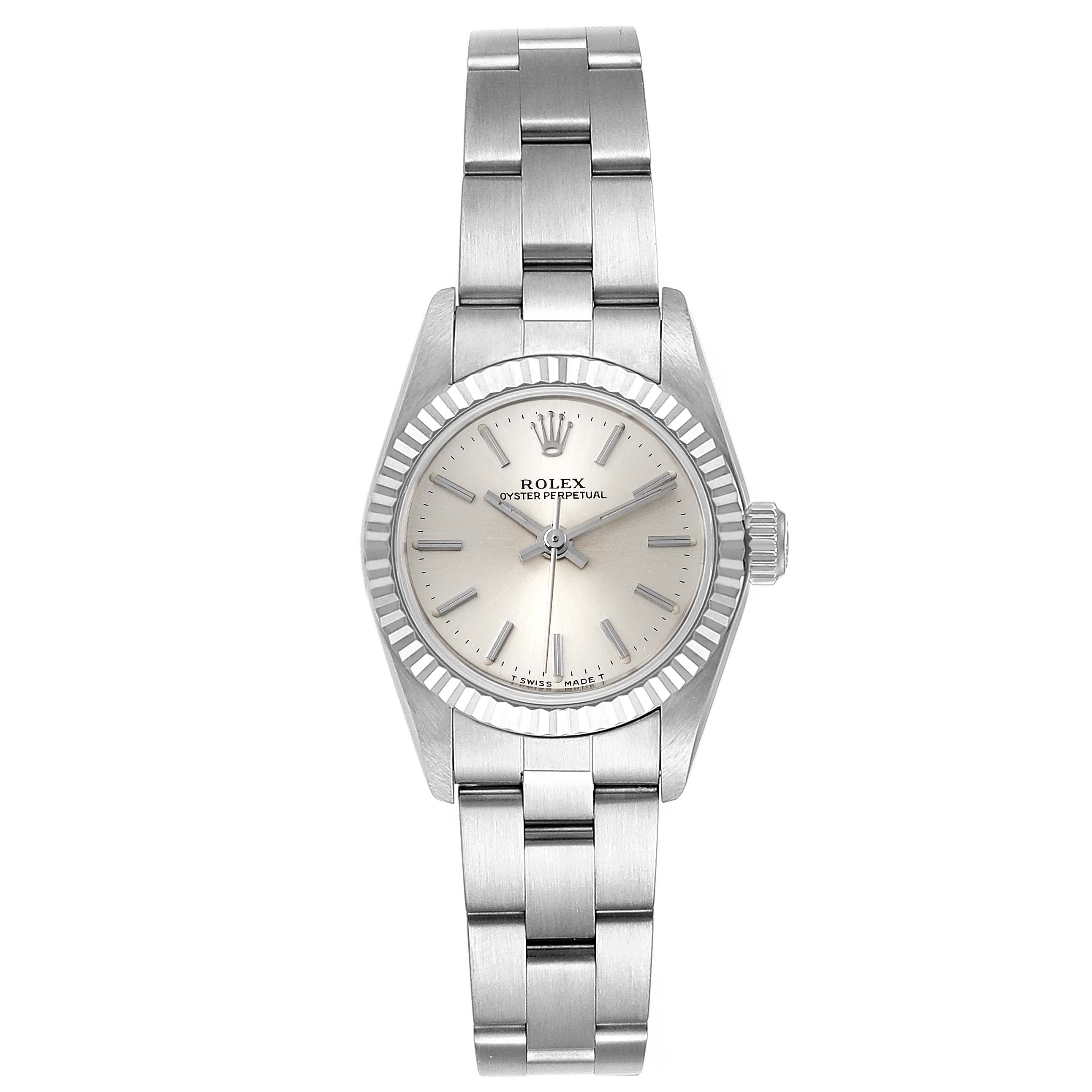 This image shows a Rolex Oyster Perpetual 67194 Women's Stainless Steel Silver Dial 67194 Women's Stainless Steel Silver Dial watch from a top-down angle, highlighting its dial, bezel, and bracelet.