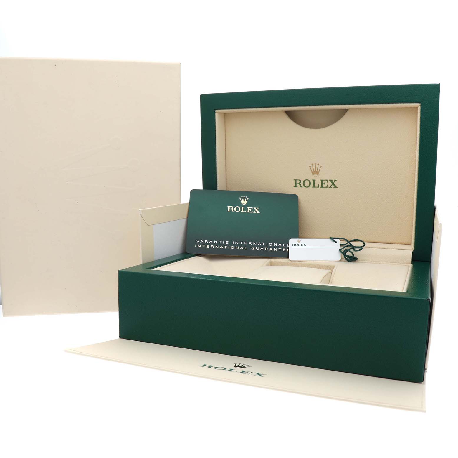 The image shows a Rolex Oyster Perpetual 124300 Men's Stainless Steel Blue Dial packaging, including a green box, warranty card, and tag.