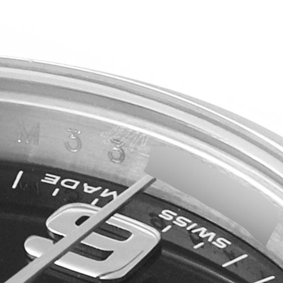 The image shows a close-up of the dial and bezel of a Rolex Oyster Perpetual 176200 Women's Stainless Steel Black Dial 176200 Women's Stainless Steel Black Dial, highlighting the minute markers and part of the number 9.