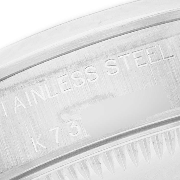The image shows a close-up of the stainless steel case back of the Rolex Oyster Perpetual 76080 Women
s Stainless Steel Silver Dial 76080 Women
s Stainless Steel Silver Dial watch.
