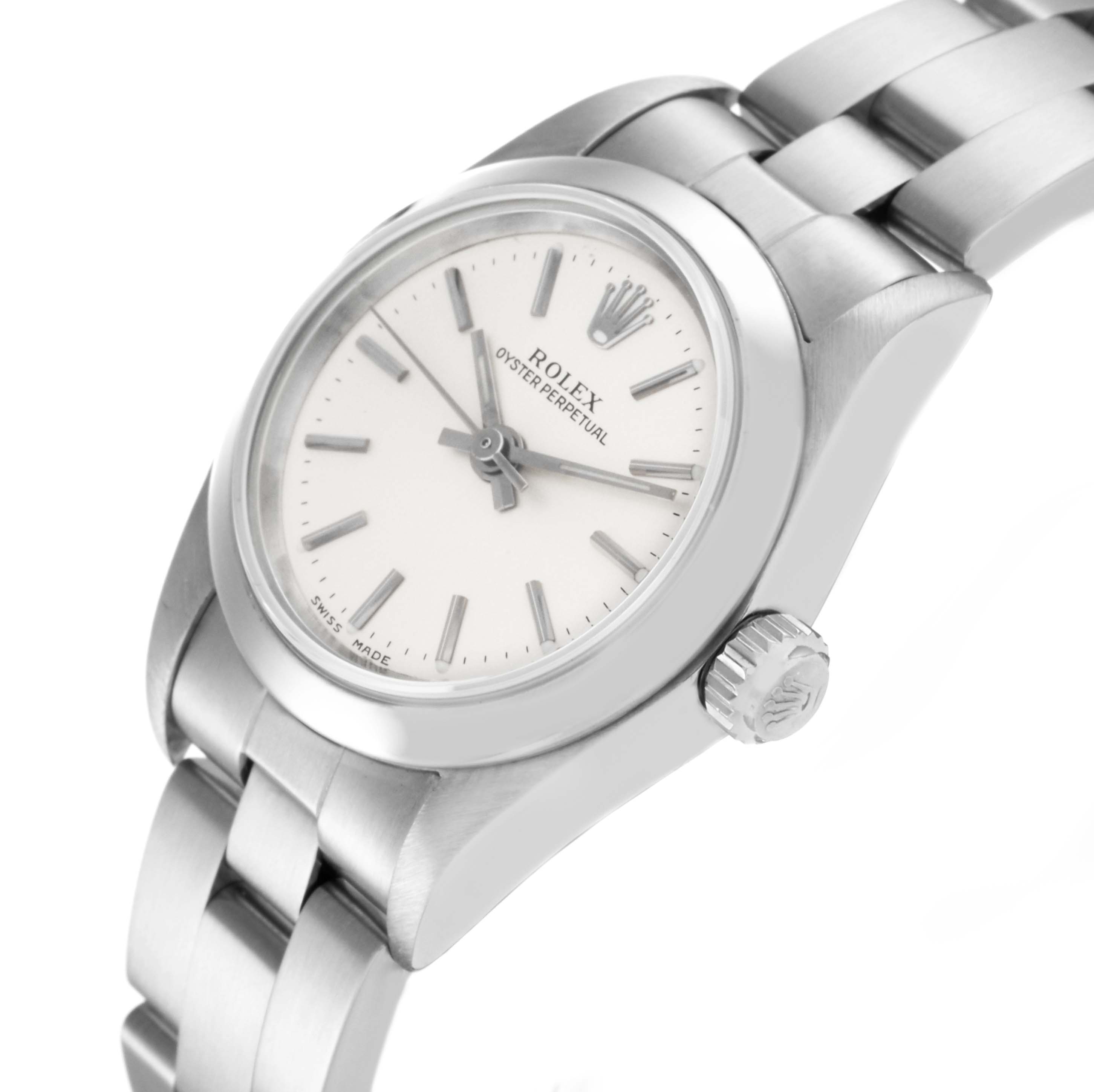 The Rolex Oyster Perpetual 76080 Women
s Stainless Steel Silver Dial 76080 Women
s Stainless Steel Silver Dial watch is shown from a slightly elevated side angle, highlighting the face, bezel, and bracelet.