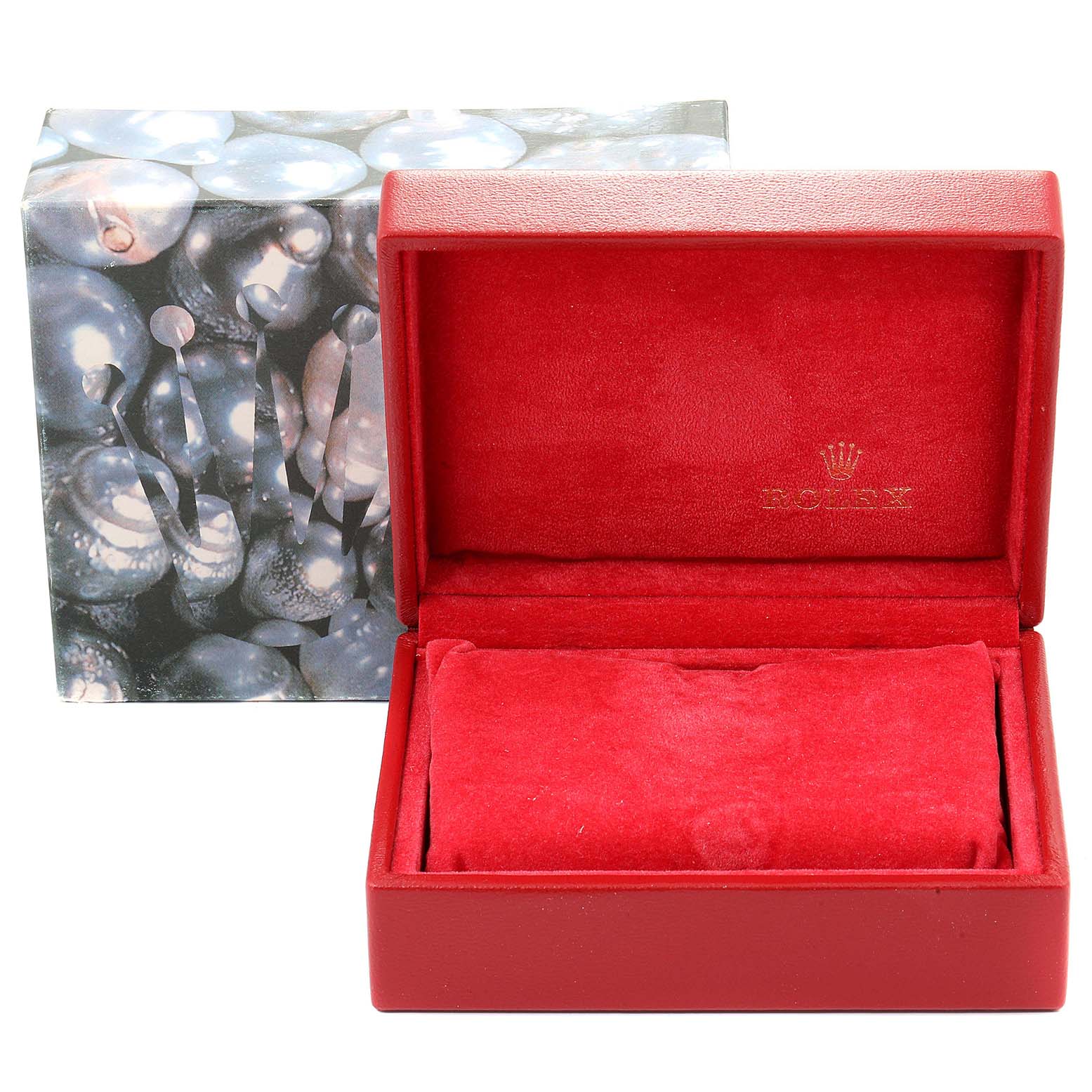 The image shows a red Rolex box for the Oyster Perpetual model, open with red velvet interior and closed exterior packaging.