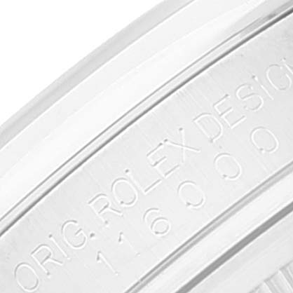 The image shows a close-up of the Rolex Oyster Perpetual 116000 Men's Stainless Steel Grey Dial 116000 Men's Stainless Steel Grey Dial's case side, displaying the engraved text with the model number.