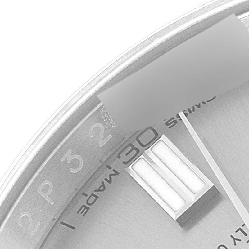 The image shows a close-up of the dial and outer rim of a Rolex Oyster Perpetual 116000 Men's Stainless Steel Grey Dial 116000 Men's Stainless Steel Grey Dial watch, focusing on the 30-minute marker.