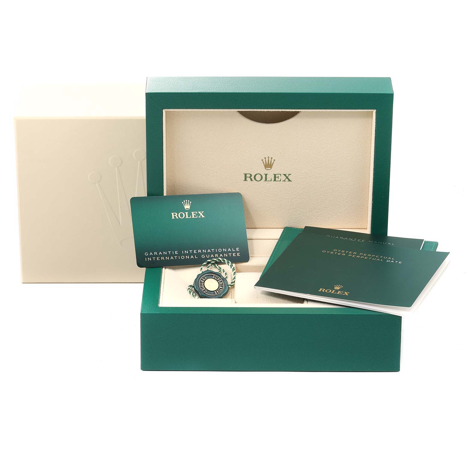 This image shows the packaging, international guarantee card, and manuals of a Rolex Oyster Perpetual 276200 Women
s Stainless Steel Pink Dial 276200 Women
s Stainless Steel Pink Dial watch.