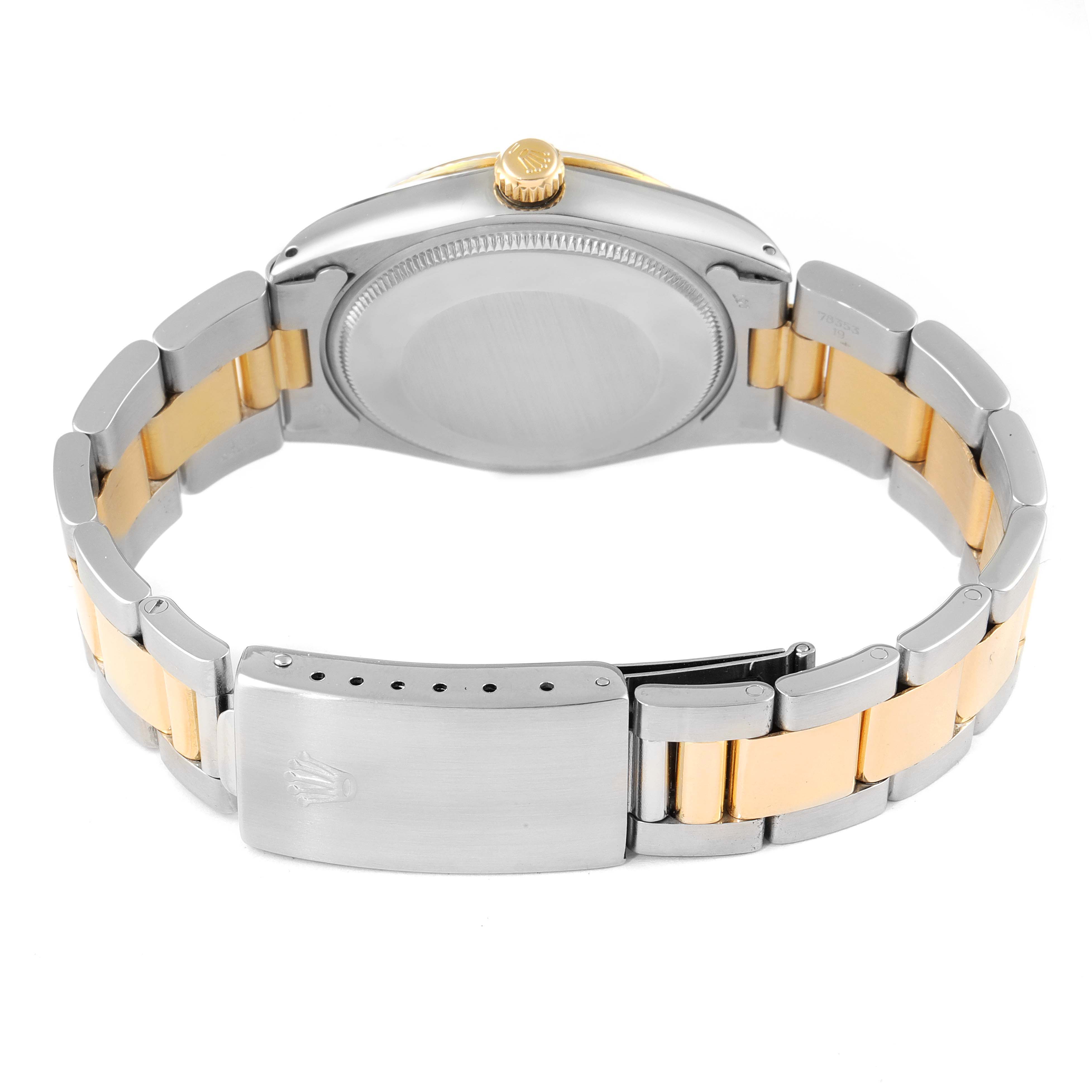 This image shows the back view of a Rolex Oyster Perpetual 1005 Men's Steel and Gold (two tone) Champagne Dial 1005 Men's Steel and Gold (two tone) Champagne Dial watch, highlighting the bracelet, clasp, and case back.