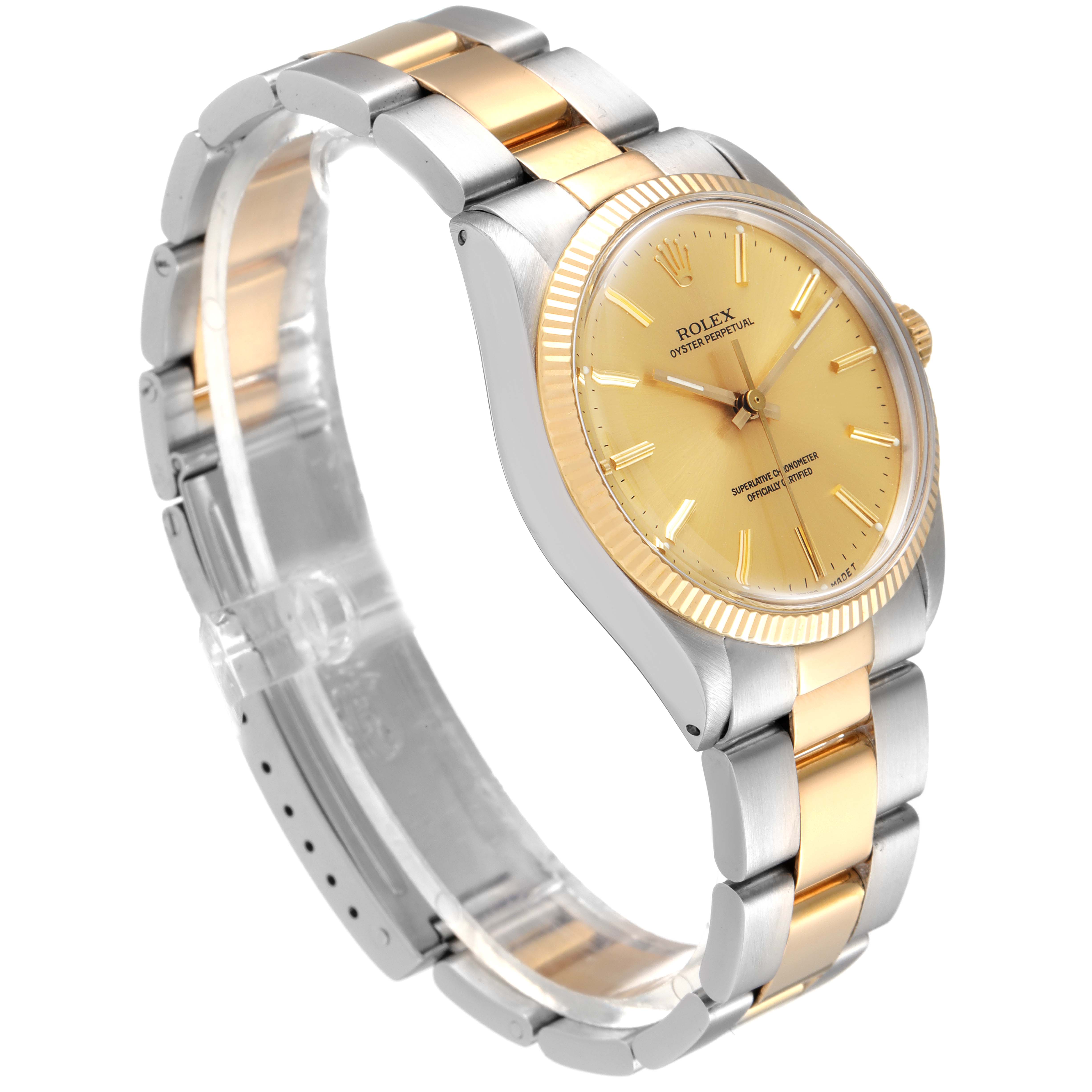 The Rolex Oyster Perpetual 1005 Men's Steel and Gold (two tone) Champagne Dial 1005 Men's Steel and Gold (two tone) Champagne Dial watch is shown at an angle displaying its gold dial, fluted bezel, and two-tone metal bracelet.
