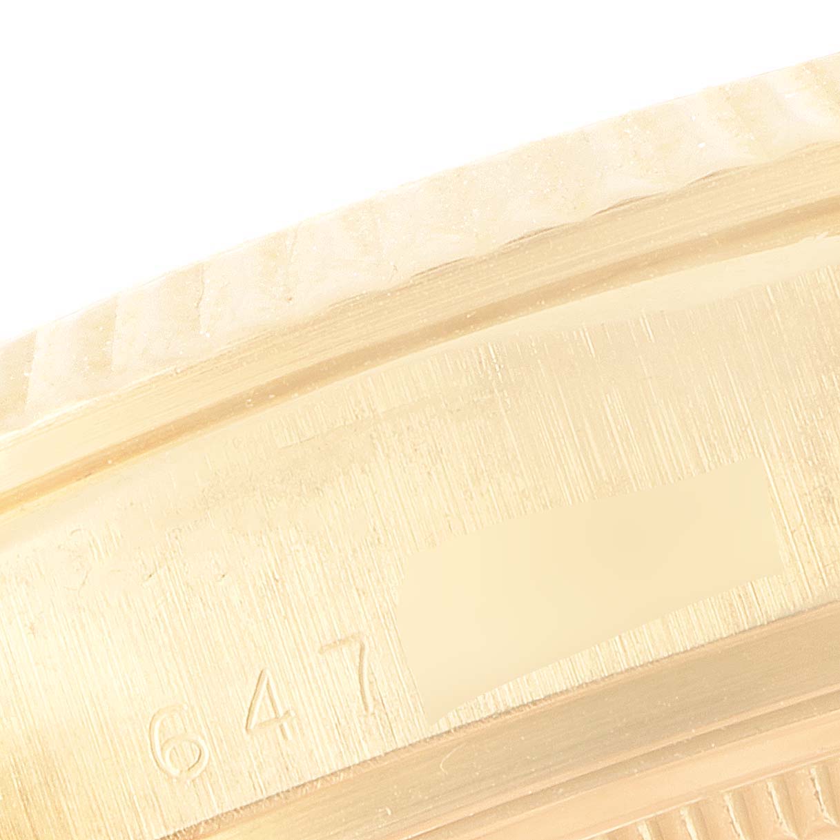 The image shows a close-up angle of the bezel and part of the case of a Rolex President 18038 Men
s Yellow Gold Champagne Dial 18038 Men
s Yellow Gold Champagne Dial model watch.