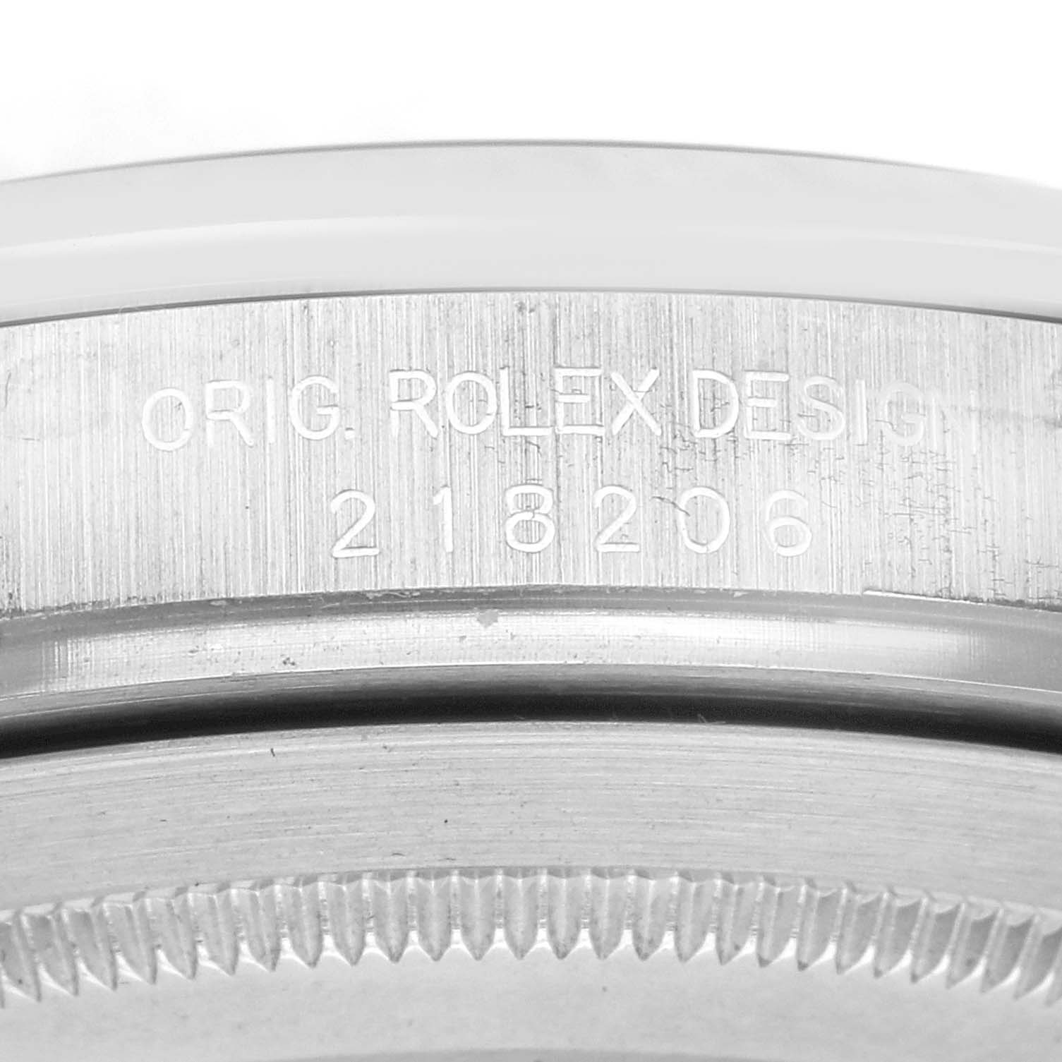 The image shows a close-up of the etched side of the bezel or case from a Rolex President 218206 Men's Platinum Blue Dial 218206 Men's Platinum Blue Dial model.
