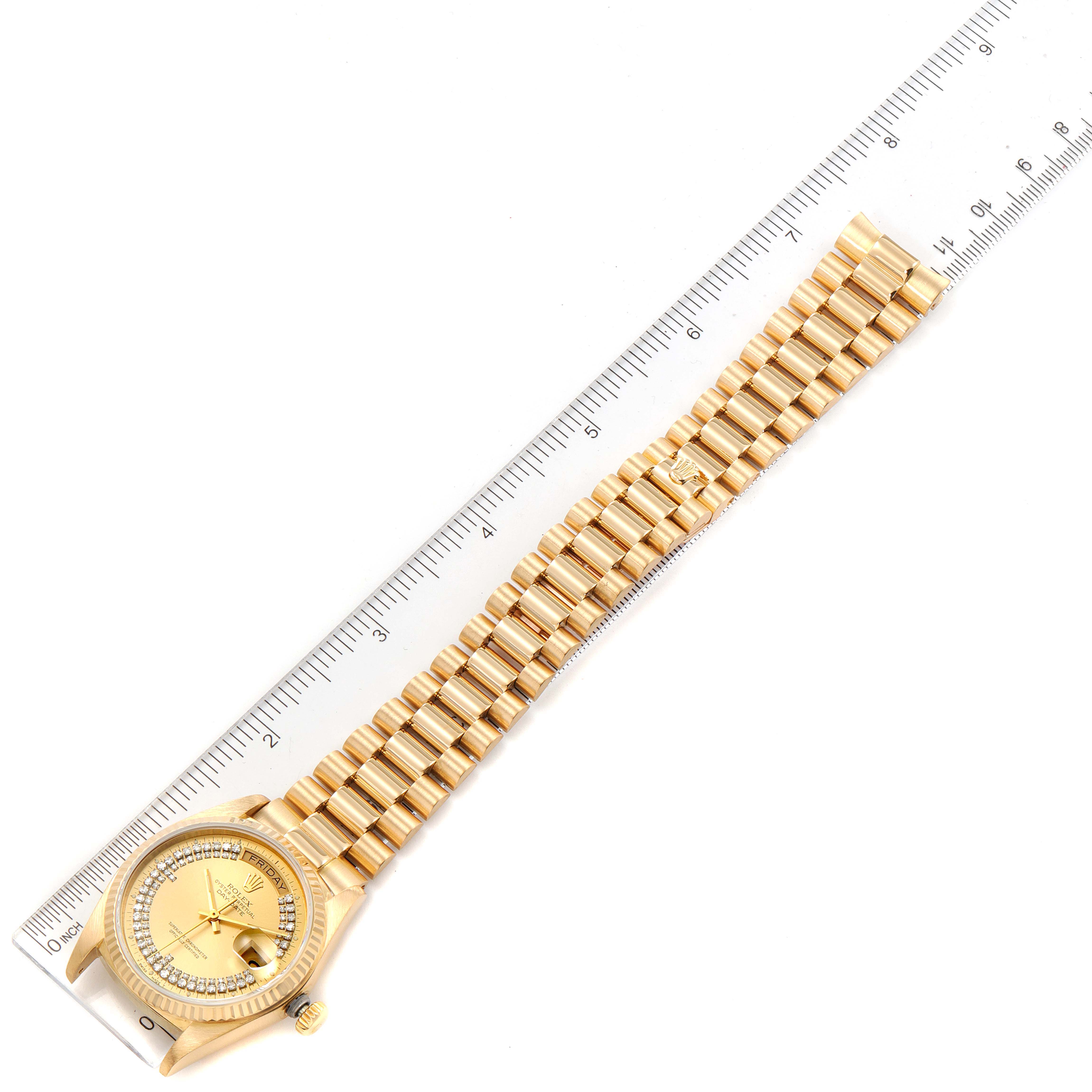 This image shows a Rolex President 18038 Men's Yellow Gold Champagne Dial 18038 Men's Yellow Gold Champagne Dial model watch laid flat, with a ruler positioned alongside for measurement reference.