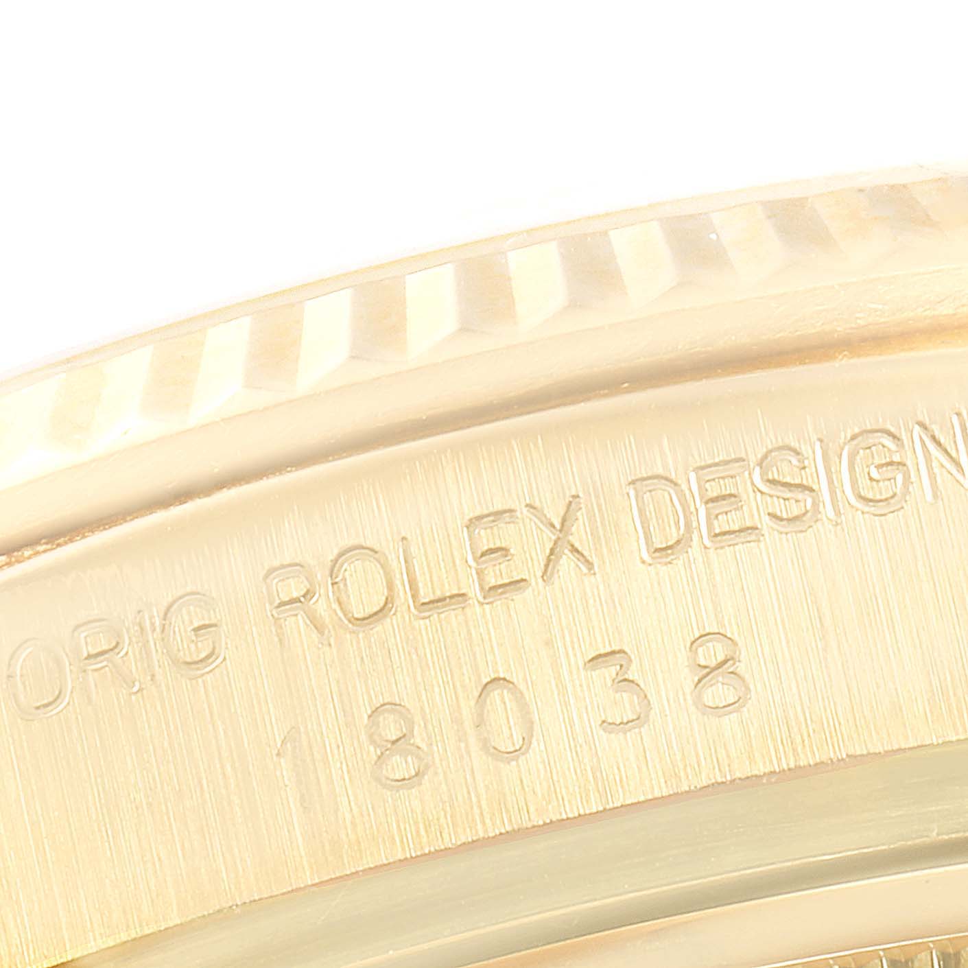 This close-up image shows the engraved bezel and case side of the Rolex President 18038 Men's Yellow Gold Champagne Dial 18038 Men's Yellow Gold Champagne Dial model, highlighting the brand and design details.