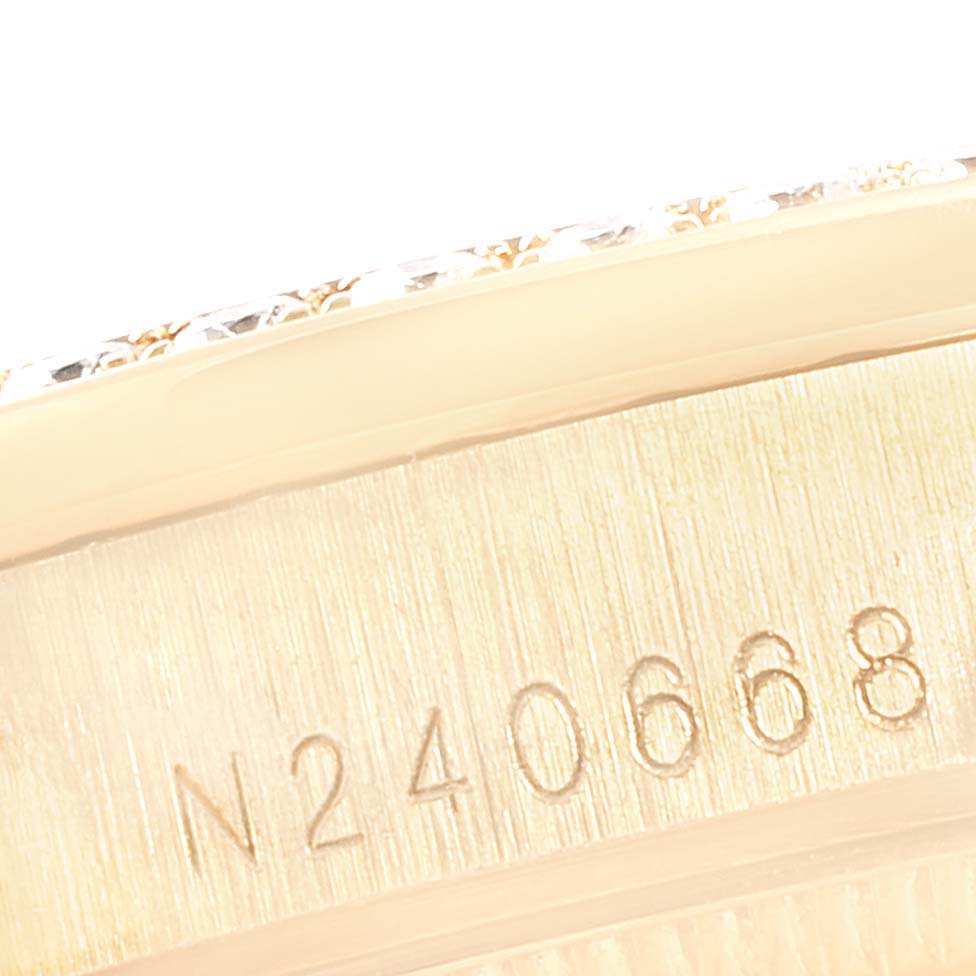 The image shows a close-up of the serial number engraving on the side of a Rolex President 68158 Women's Yellow Gold Champagne Dial 68158 Women's Yellow Gold Champagne Dial model watch.