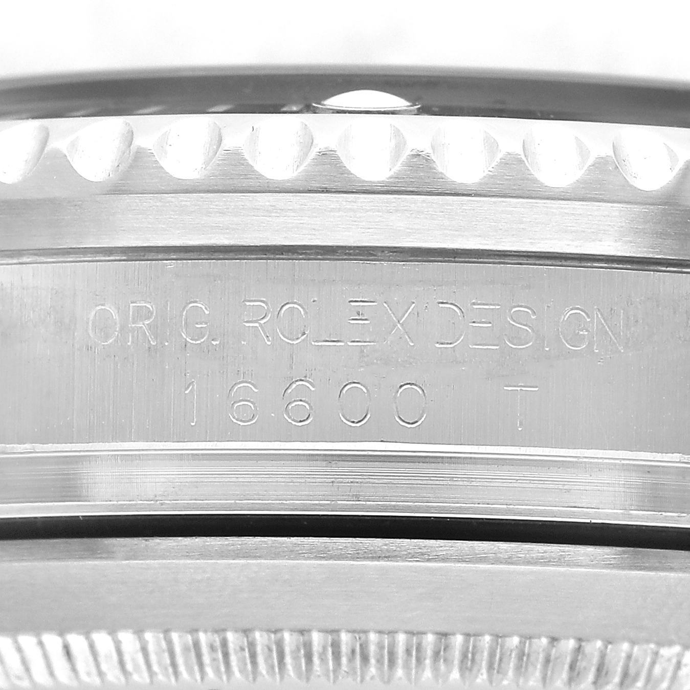 The image shows a close-up of the Rolex Sea-Dweller 16600 Men's Stainless Steel Black Dial's case side engraved with "ORIG. ROLEX DESIGN 16600 T."