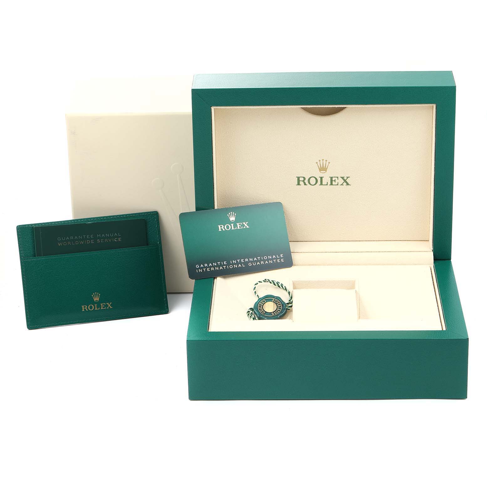 The image shows the packaging and accessories for a Rolex Sky-Dweller 326934 Men's Stainless Steel Black Dial 326934 Men's Stainless Steel Black Dial, including the box, guarantee manuals, and a hangtag.