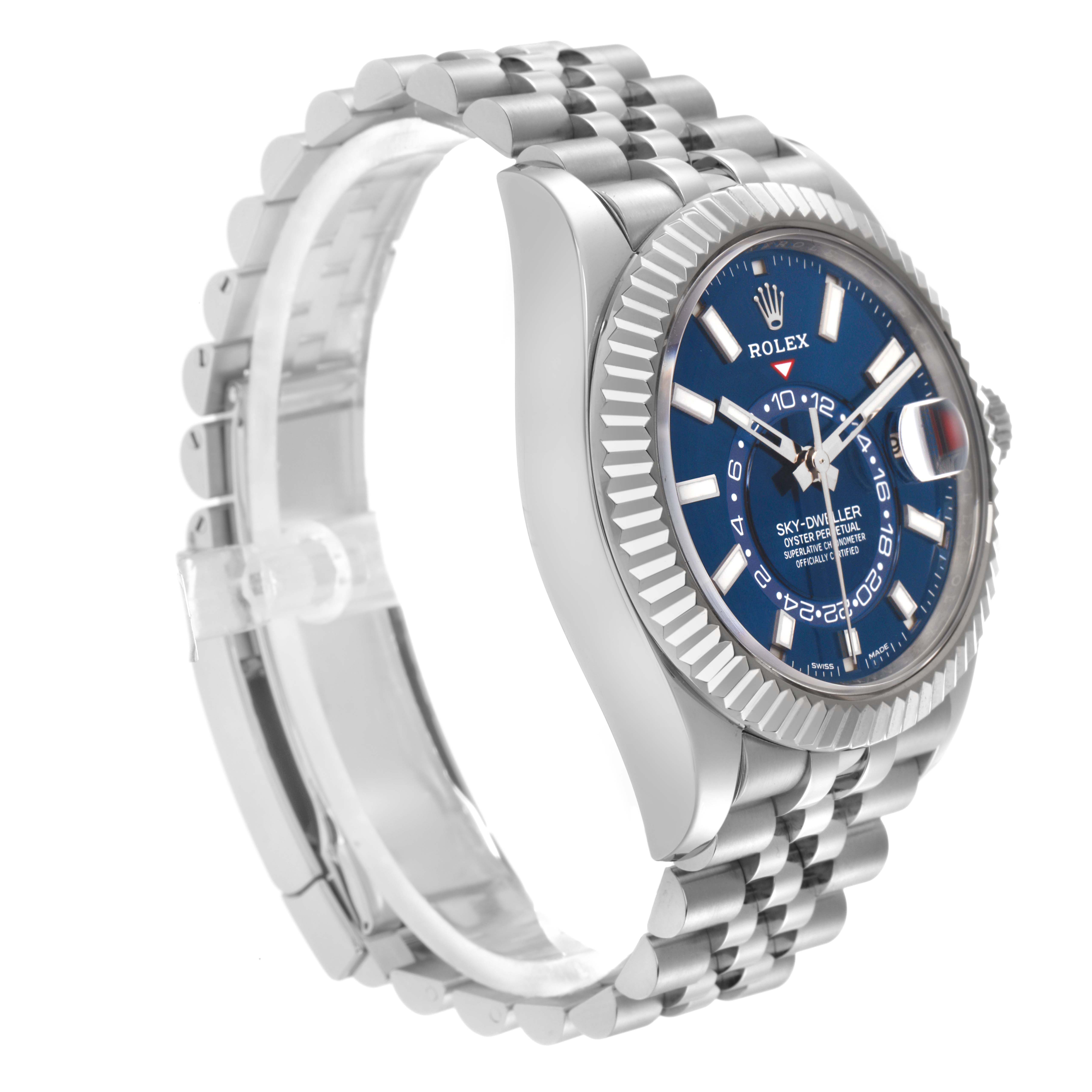The Rolex Sky-Dweller 326934 Men
s Stainless Steel Blue Dial 326934 Men
s Stainless Steel Blue Dial watch is shown at a side angle, highlighting the blue dial, fluted bezel, and Jubilee bracelet.