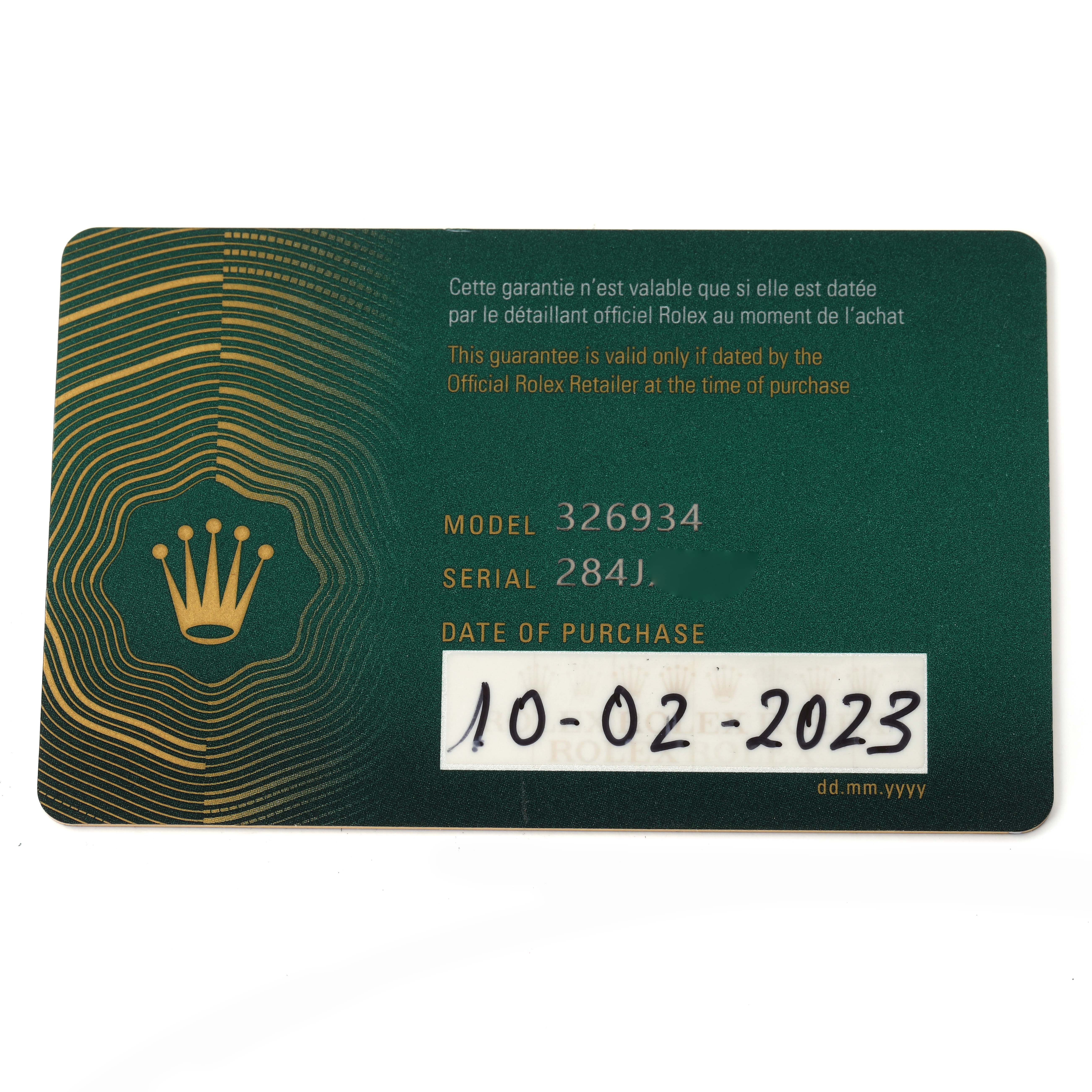 The image shows a warranty card for the Rolex Sky-Dweller 326934 Men
s Stainless Steel Blue Dial 326934 Men
s Stainless Steel Blue Dial, displaying the model and purchase details.