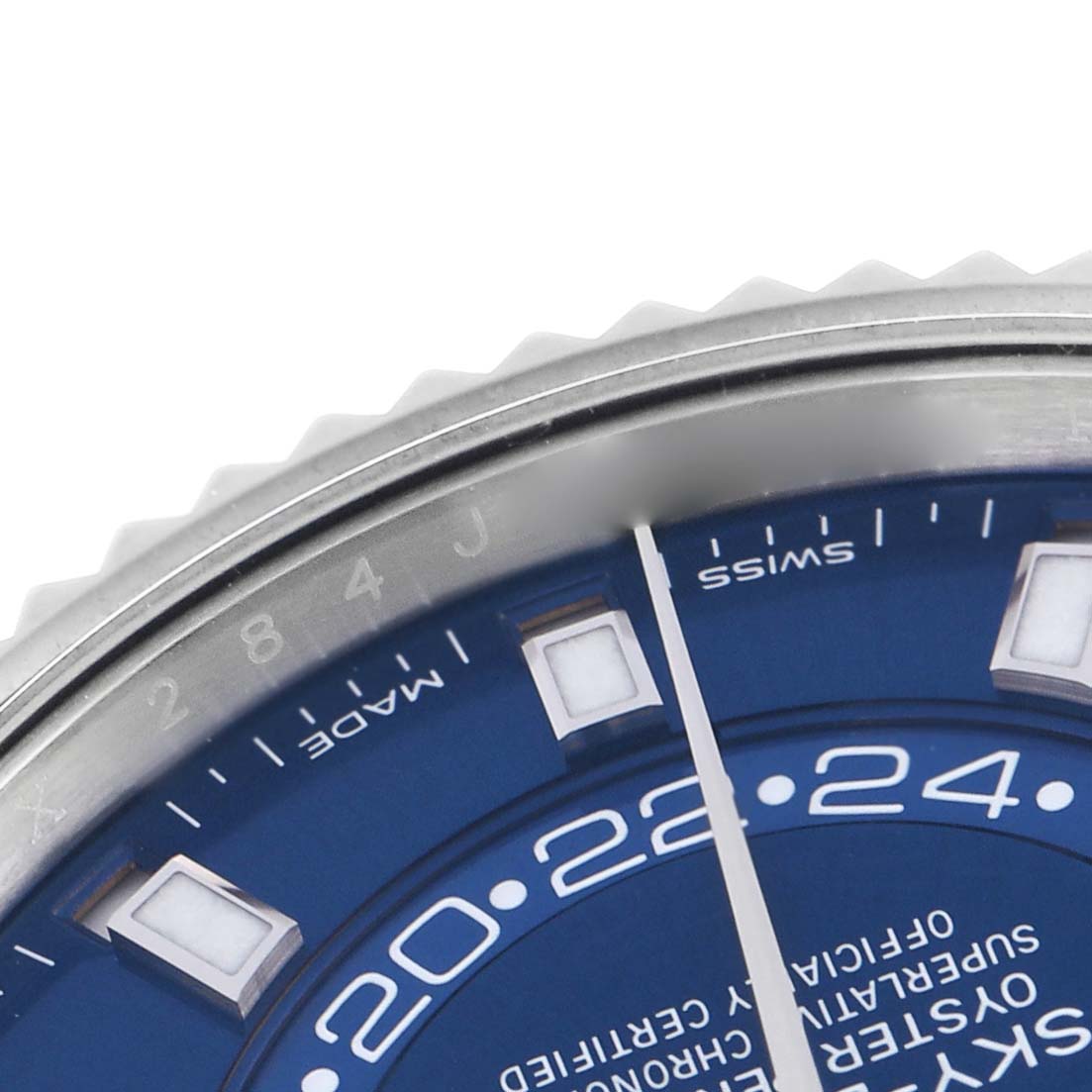 The image shows a close-up of the Rolex Sky-Dweller 326934 Men
s Stainless Steel Blue Dial 326934 Men
s Stainless Steel Blue Dial
s blue dial and part of the bezel from an angled top view.