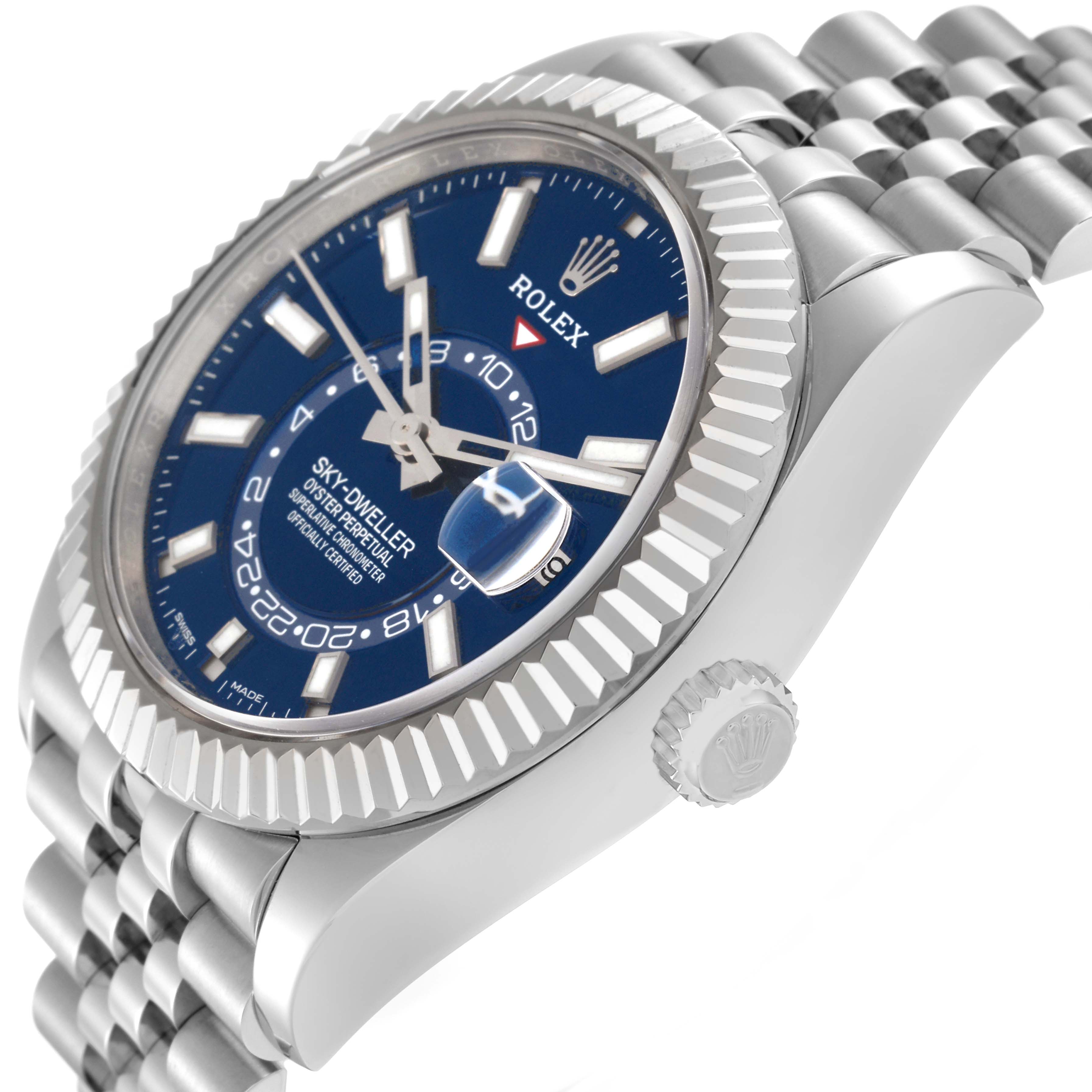 The Rolex Sky-Dweller 326934 Men
s Stainless Steel Blue Dial 326934 Men
s Stainless Steel Blue Dial watch is shown at an angled side view, highlighting the dial, bezel, crown, and part of the bracelet.