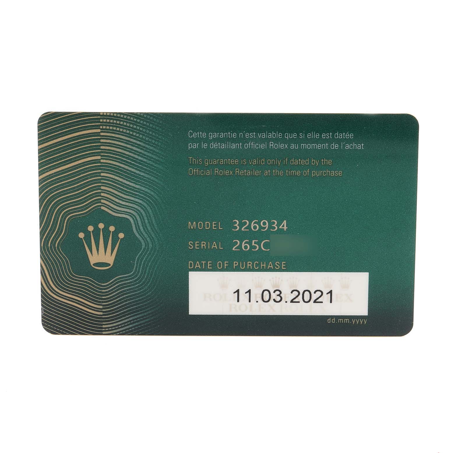 This is a close-up of a Rolex Sky-Dweller 326934 Men's Stainless Steel White Dial 326934 Men's Stainless Steel White Dial model warranty card, showing the model number, serial number, and date of purchase.