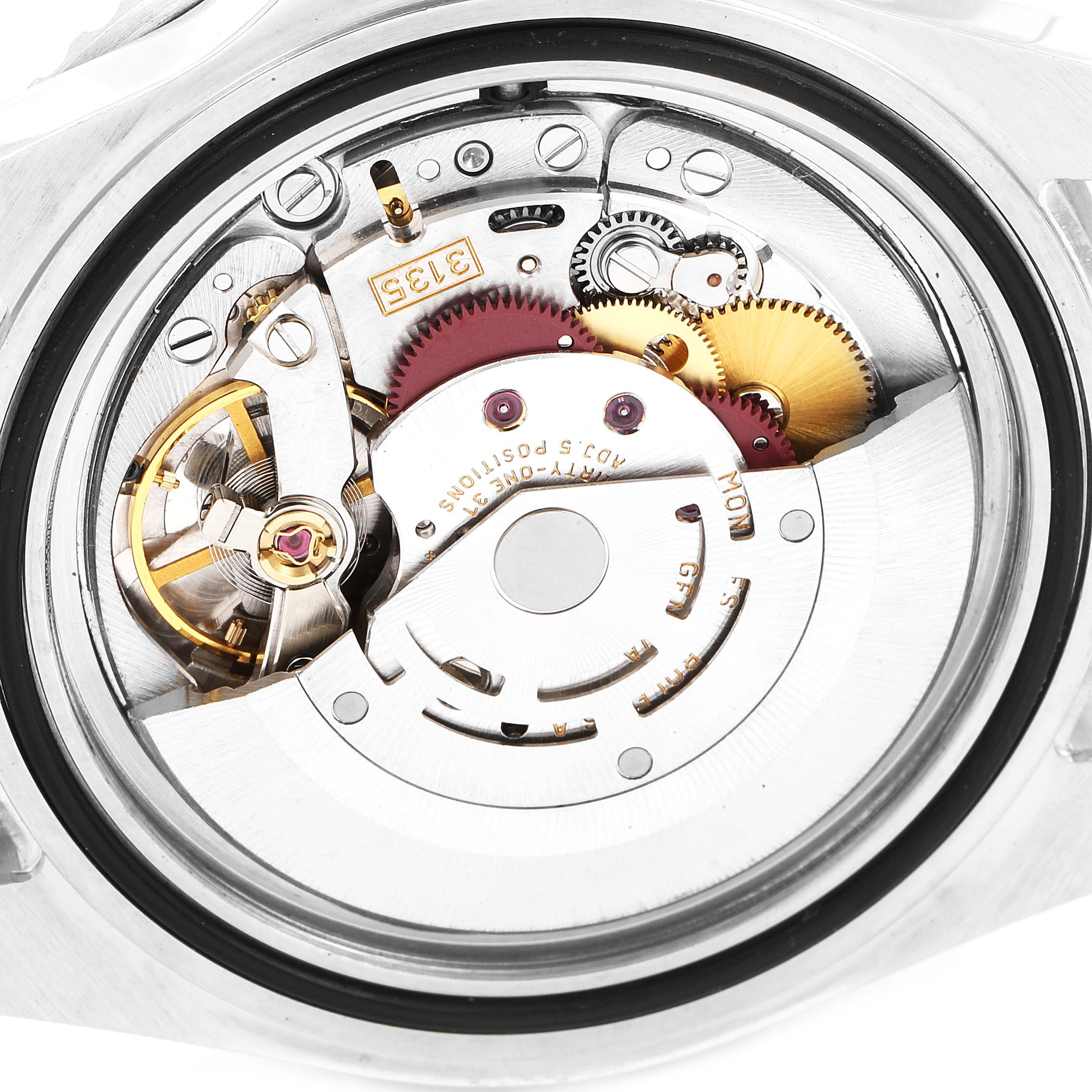 The image shows the movement and internal mechanics of a Rolex Submariner 16610LV Men
s Stainless Steel Black Dial 16610LV Men
s Stainless Steel Black Dial watch from a close-up, top-down angle.