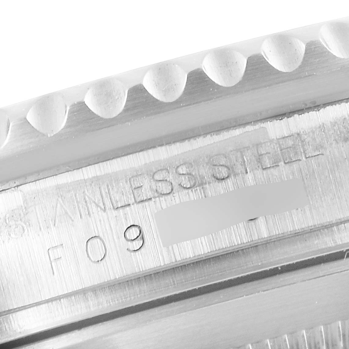 This image shows a close-up angle of the case back and engraved details of a Rolex Submariner 16610LV Men
s Stainless Steel Black Dial 16610LV Men
s Stainless Steel Black Dial watch.