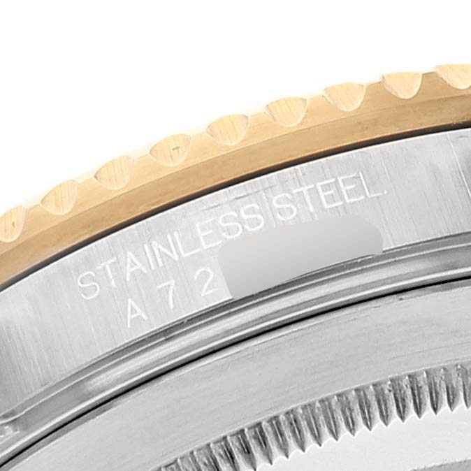Close-up of a stainless steel engraved part and gold-edged bezel of a Rolex Submariner 16613 Men
s Steel and Gold (two tone) Blue Dial 16613 Men
s Steel and Gold (two tone) Blue Dial watch.