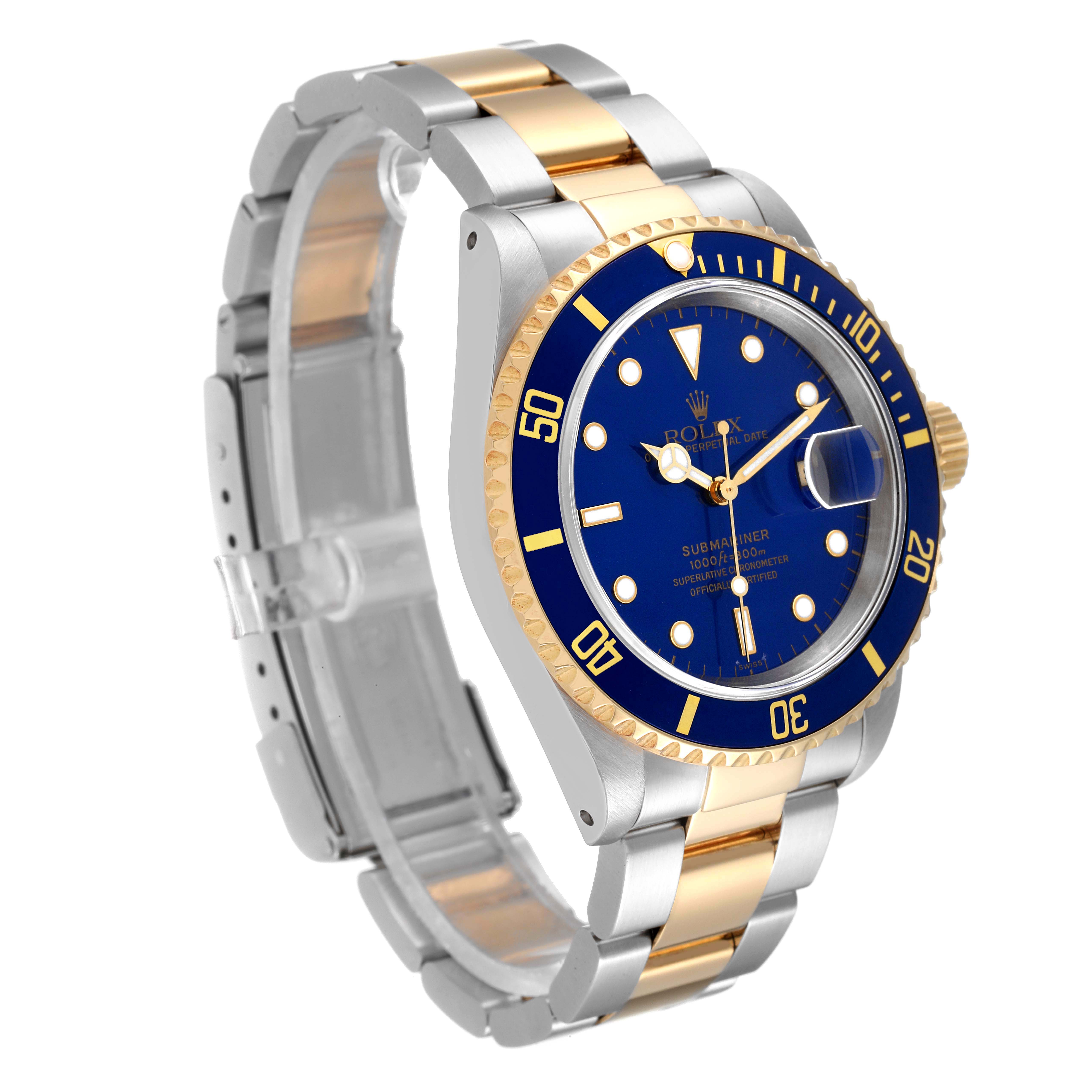 The image shows an angled view of the Rolex Submariner 16613 Men
s Steel and Gold (two tone) Blue Dial 16613 Men
s Steel and Gold (two tone) Blue Dial watch, highlighting the dial, bezel, and bracelet.