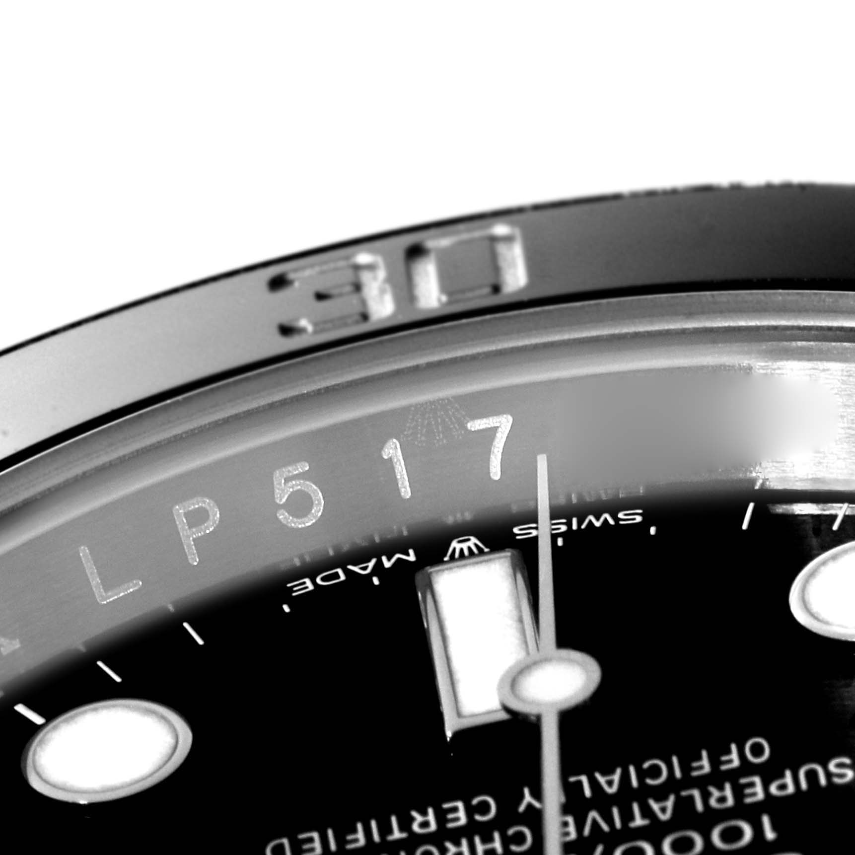 This close-up angle of the Rolex Submariner 126610 Men
s Stainless Steel Black Dial 126610 Men
s Stainless Steel Black Dial watch shows its bezel, part of the dial, and the "Swiss Made" text.