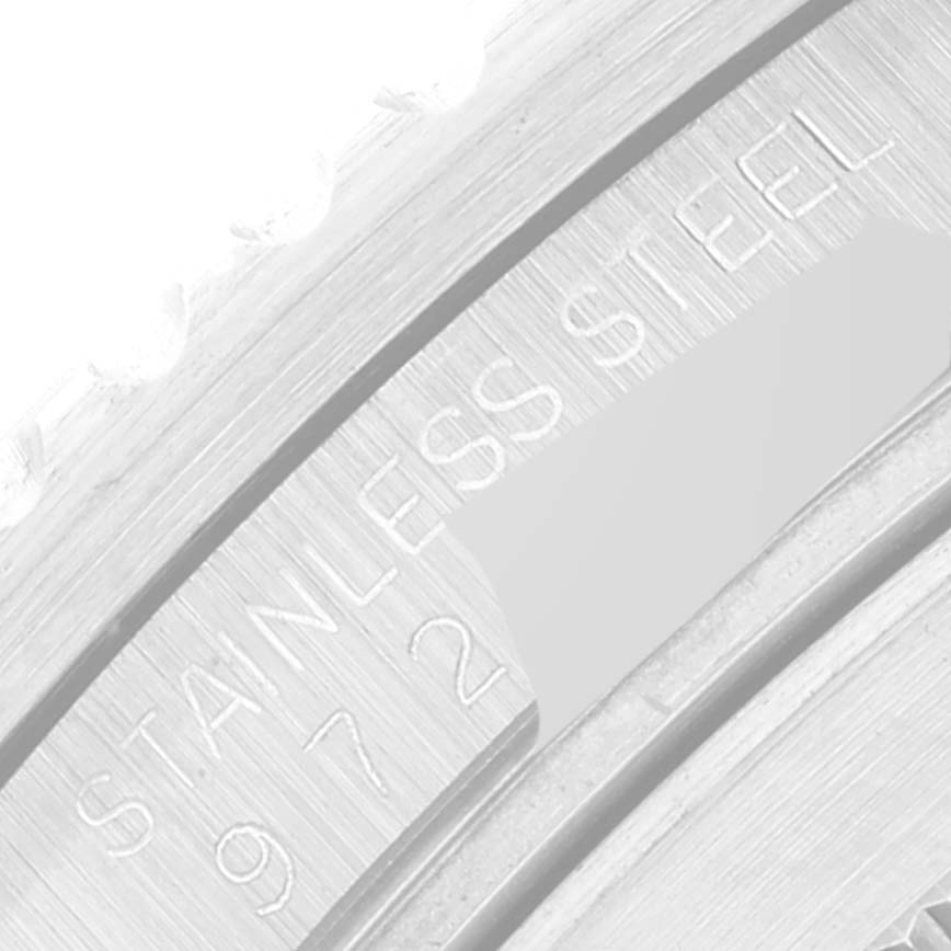 This image shows a close-up of the inner bezel and part of the engraving on a Vintage Collection Rolex watch.