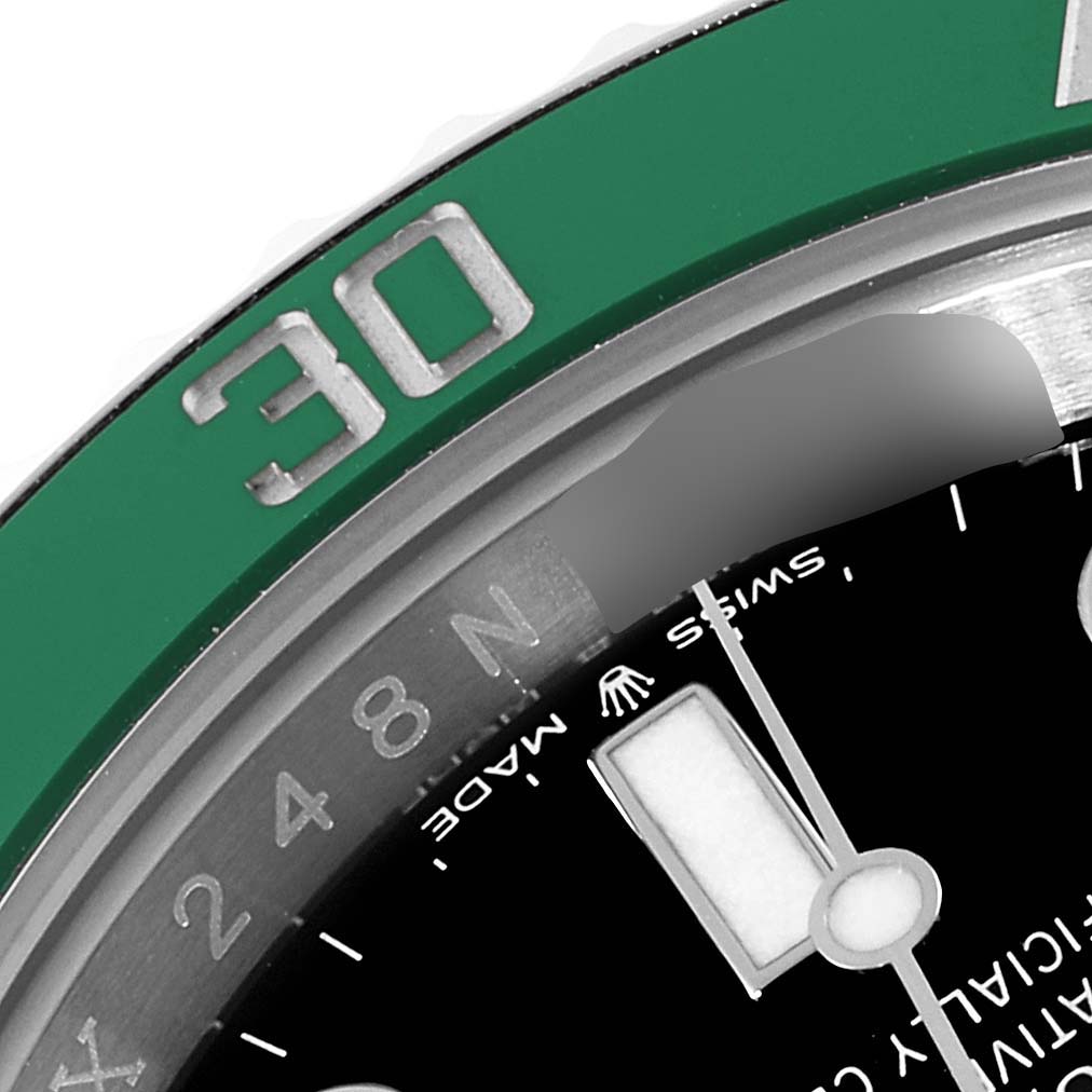 The image shows a close-up of the green bezel and part of the black dial of a Rolex Submariner 126610LV Men's Stainless Steel Black Dial 126610LV Men's Stainless Steel Black Dial.