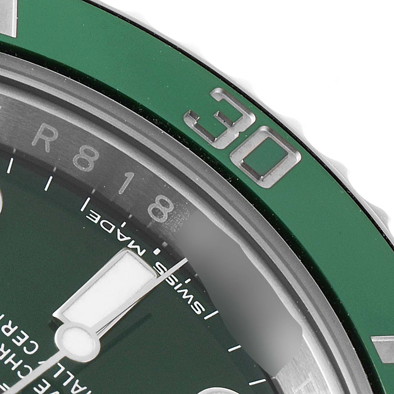 This image shows a close-up of the green bezel and part of the dial of a Rolex Submariner 116610LV Men
s Stainless Steel Green Dial 116610LV Men
s Stainless Steel Green Dial watch.