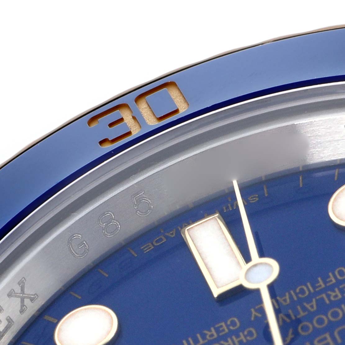 The image shows a close-up of the bezel and dial of a Rolex Submariner 116613 Men
s Steel and Gold (two tone) Blue Dial 116613 Men
s Steel and Gold (two tone) Blue Dial, highlighting the "30" marker and part of the face.