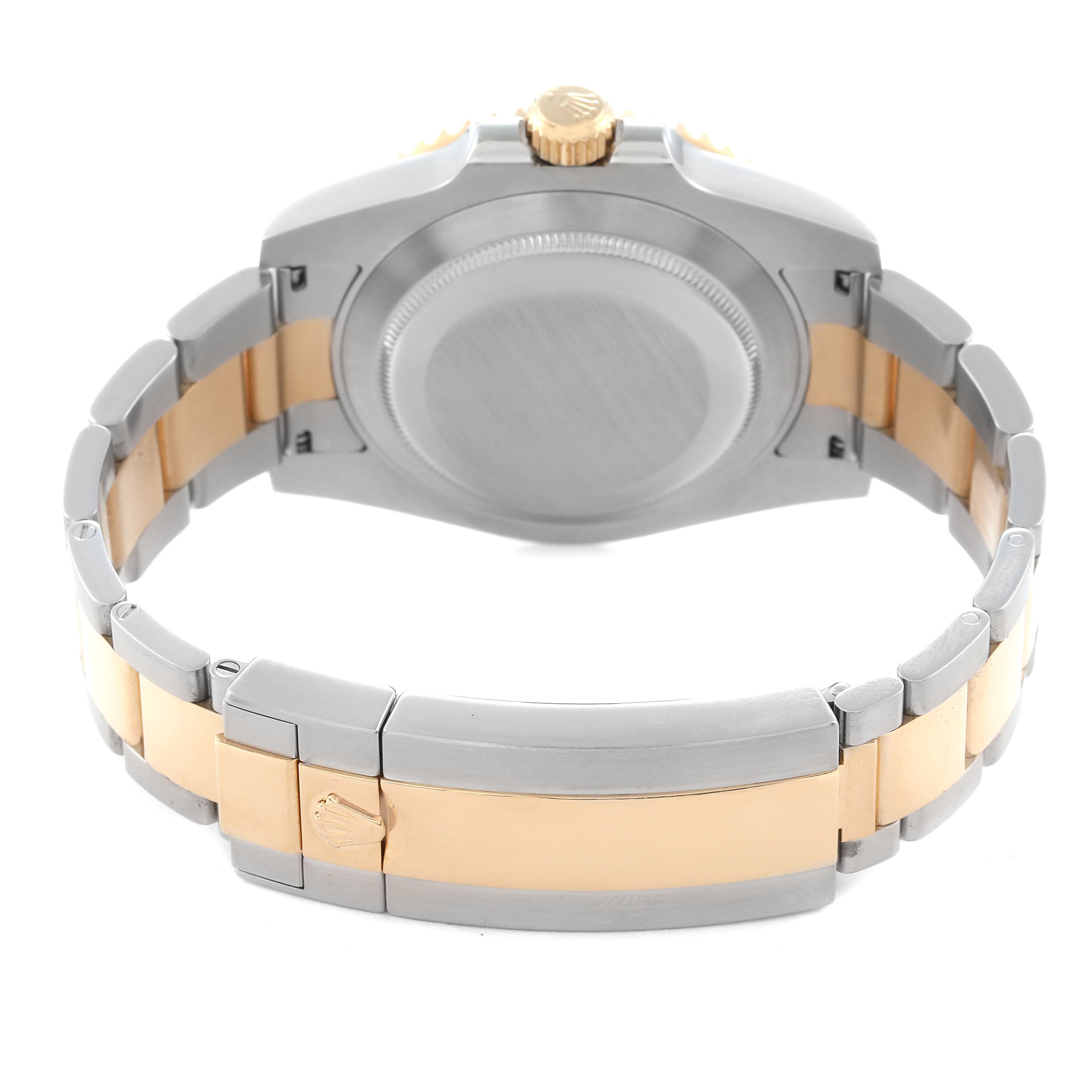 The Rolex Submariner 116613 Men
s Steel and Gold (two tone) Blue Dial 116613 Men
s Steel and Gold (two tone) Blue Dial is shown from the back, highlighting the case back, crown, and two-tone bracelet clasp.