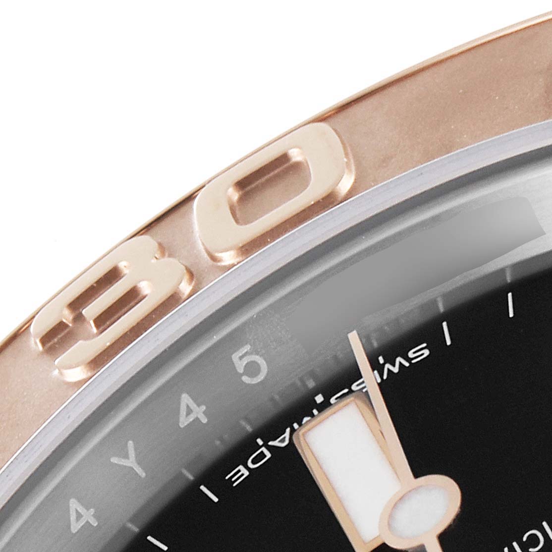 This close-up image of the Rolex Yacht-Master 116621 Men
s Steel and Gold (two tone) Black Dial 116621 Men
s Steel and Gold (two tone) Black Dial watch shows the bezel with the number 30 and part of the dial with hands.