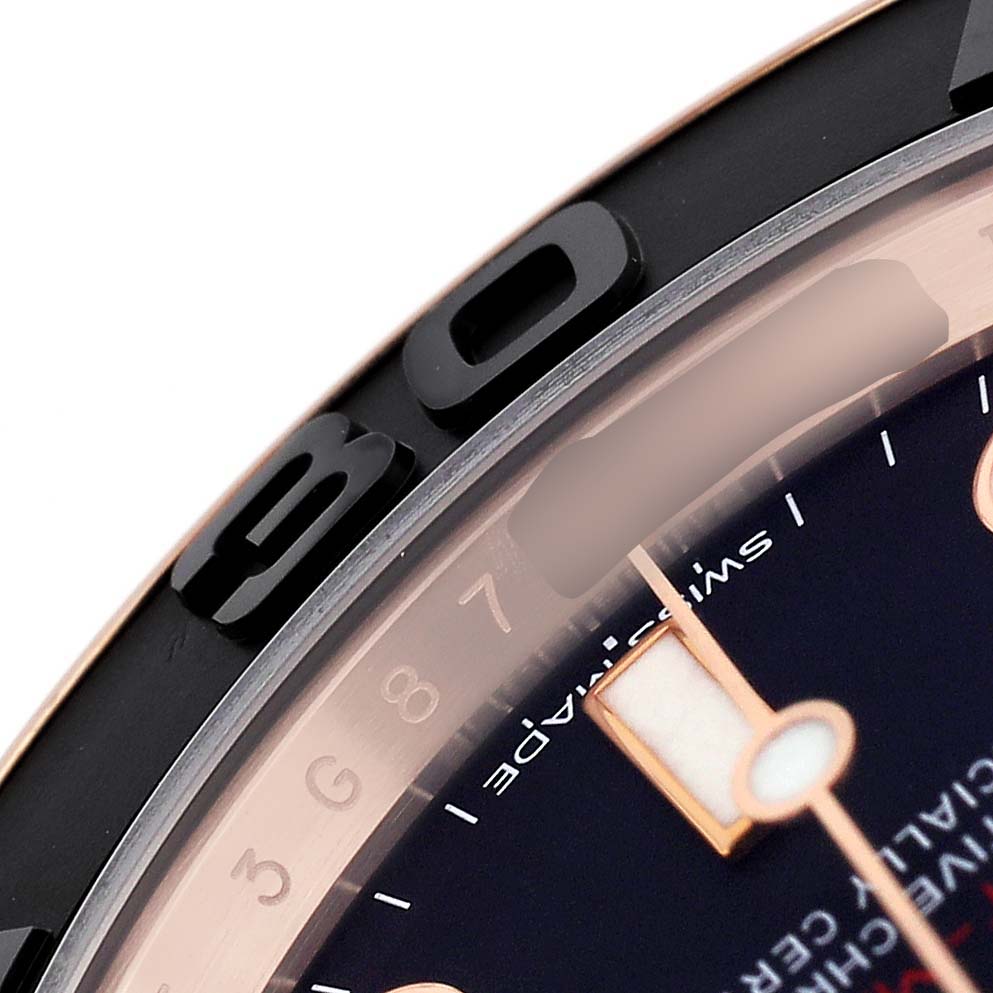 The image shows a close-up of the bezel and dial edge of the Rolex Yacht-Master 116655 Men's Rose Gold Black Dial watch, highlighting numerals and markers.