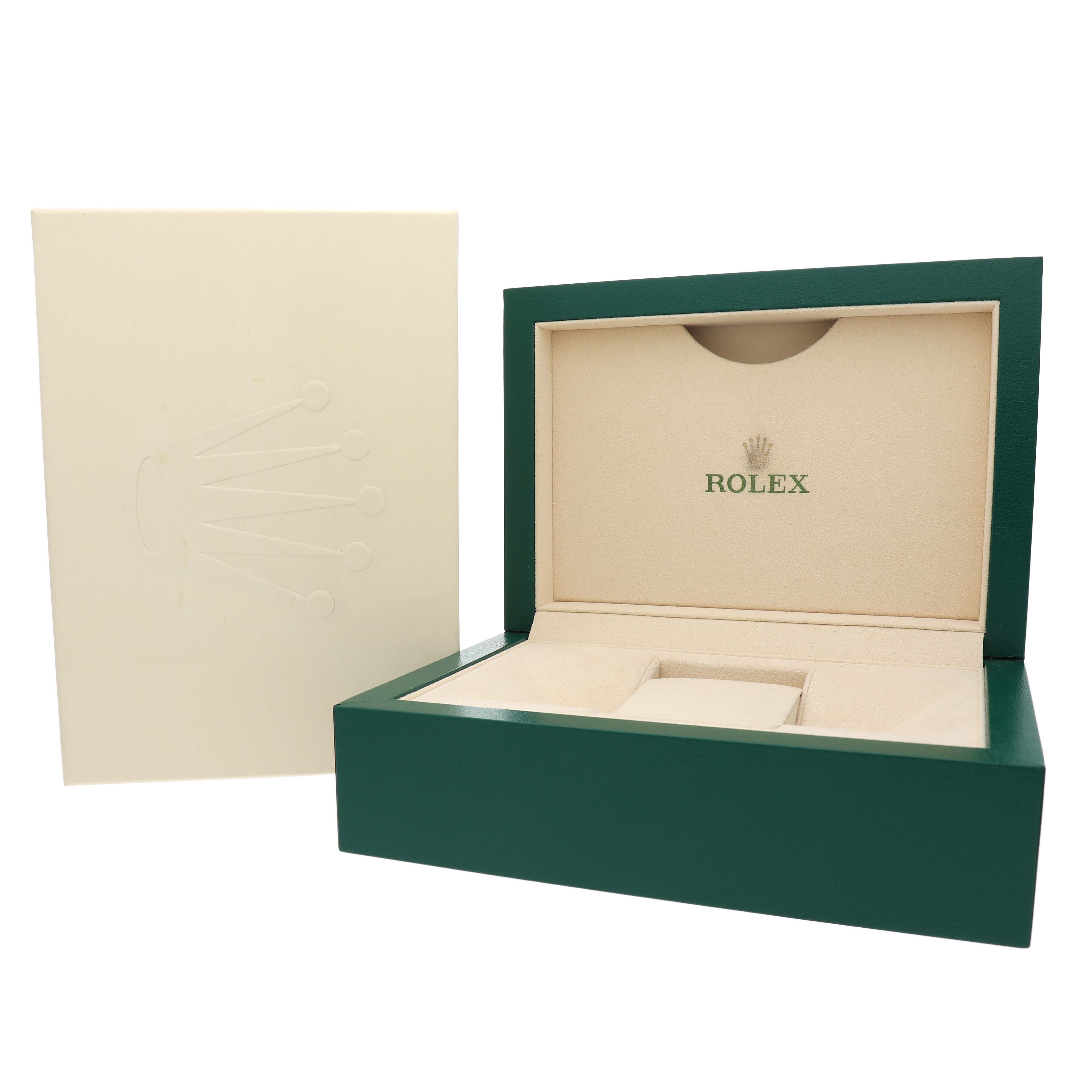 The image shows a Rolex watch box and sleeve, with the open box featuring padding for a Yacht-Master model.