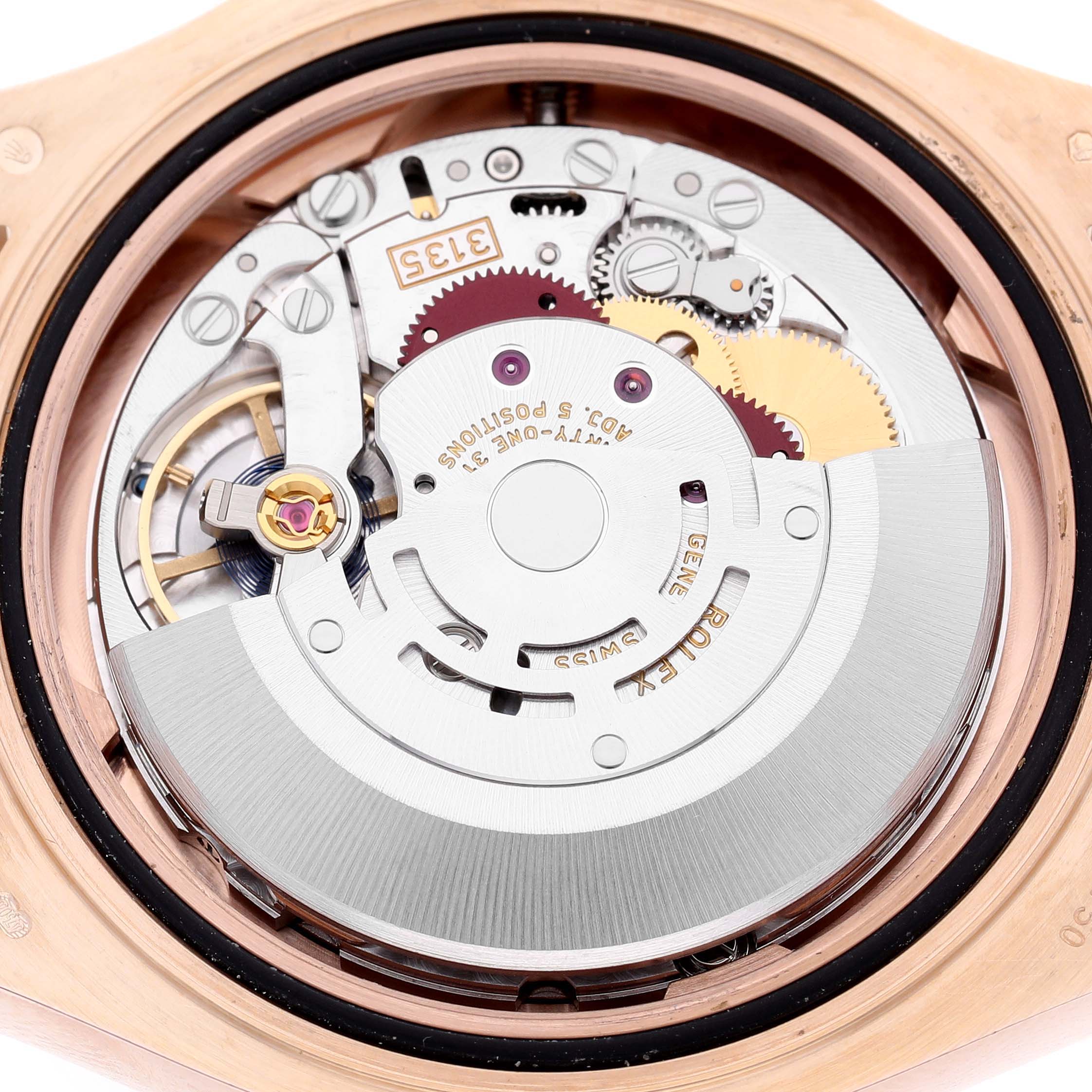 The image shows the internal movement of a Rolex Yacht-Master 116655 Men's Rose Gold Black Dial watch from the back, featuring gears and rotor assembly.