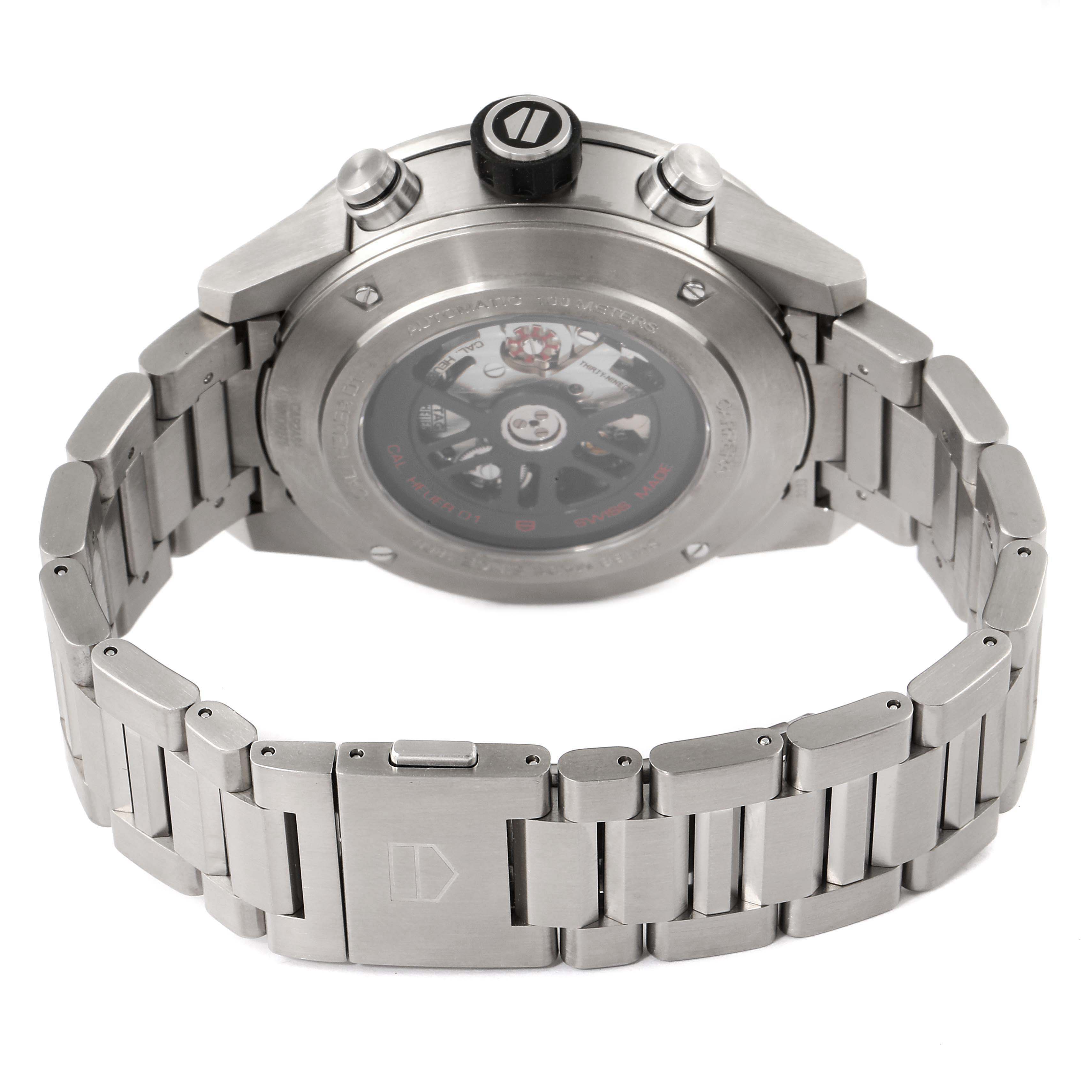 The image shows the back view of a Tag Heuer Carrera CAR2A8A.FT6072 Men's Titanium Grey Dial CAR2A8A.FT6072 Men's Titanium Grey Dial watch, displaying the bracelet, clasp, and transparent case back.