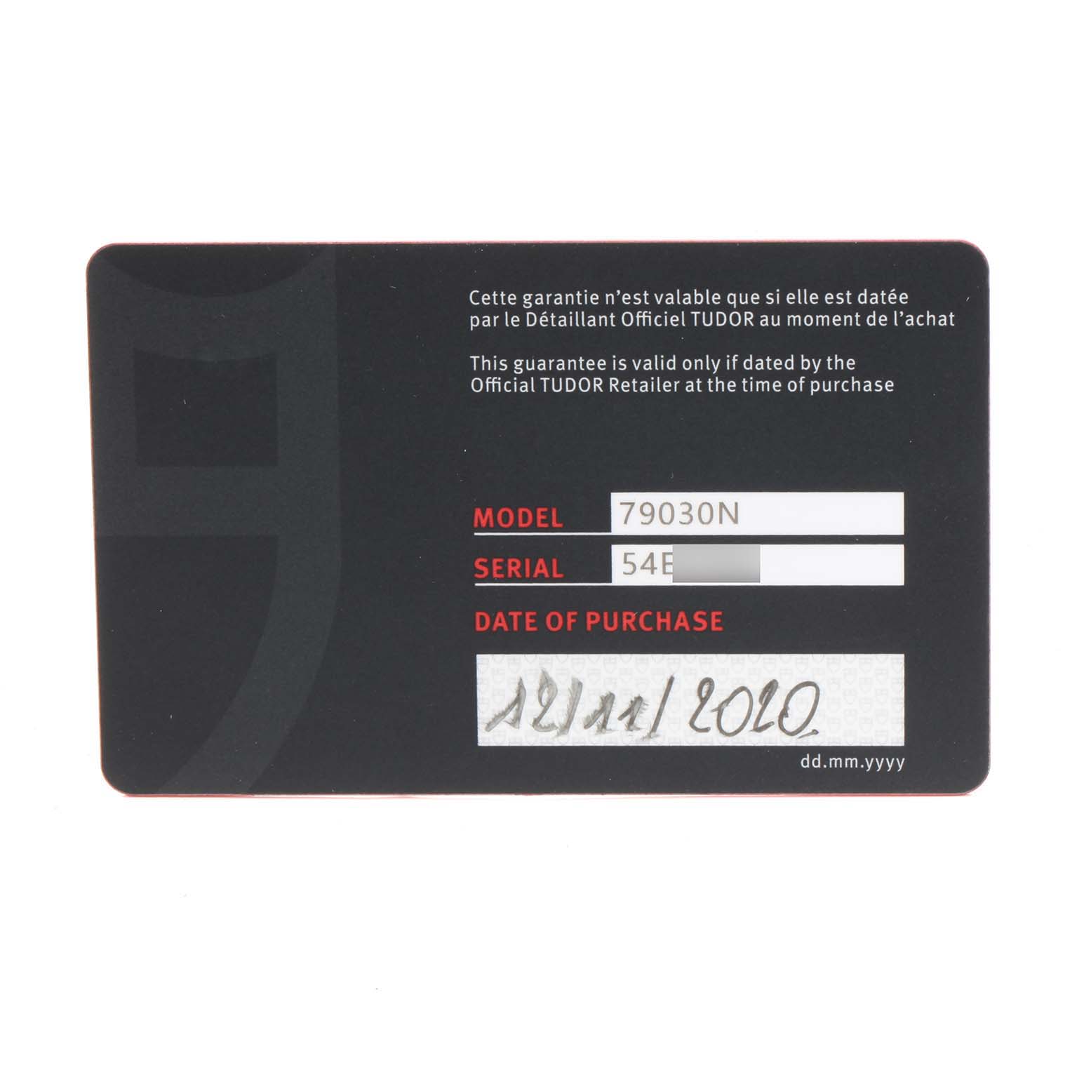 This is a warranty card for the Tudor Heritage Black Bay 79030N Men
s Stainless Steel Black Dial 79030N Men
s Stainless Steel Black Dial model 79030N, displaying the model, serial number, and date of purchase.