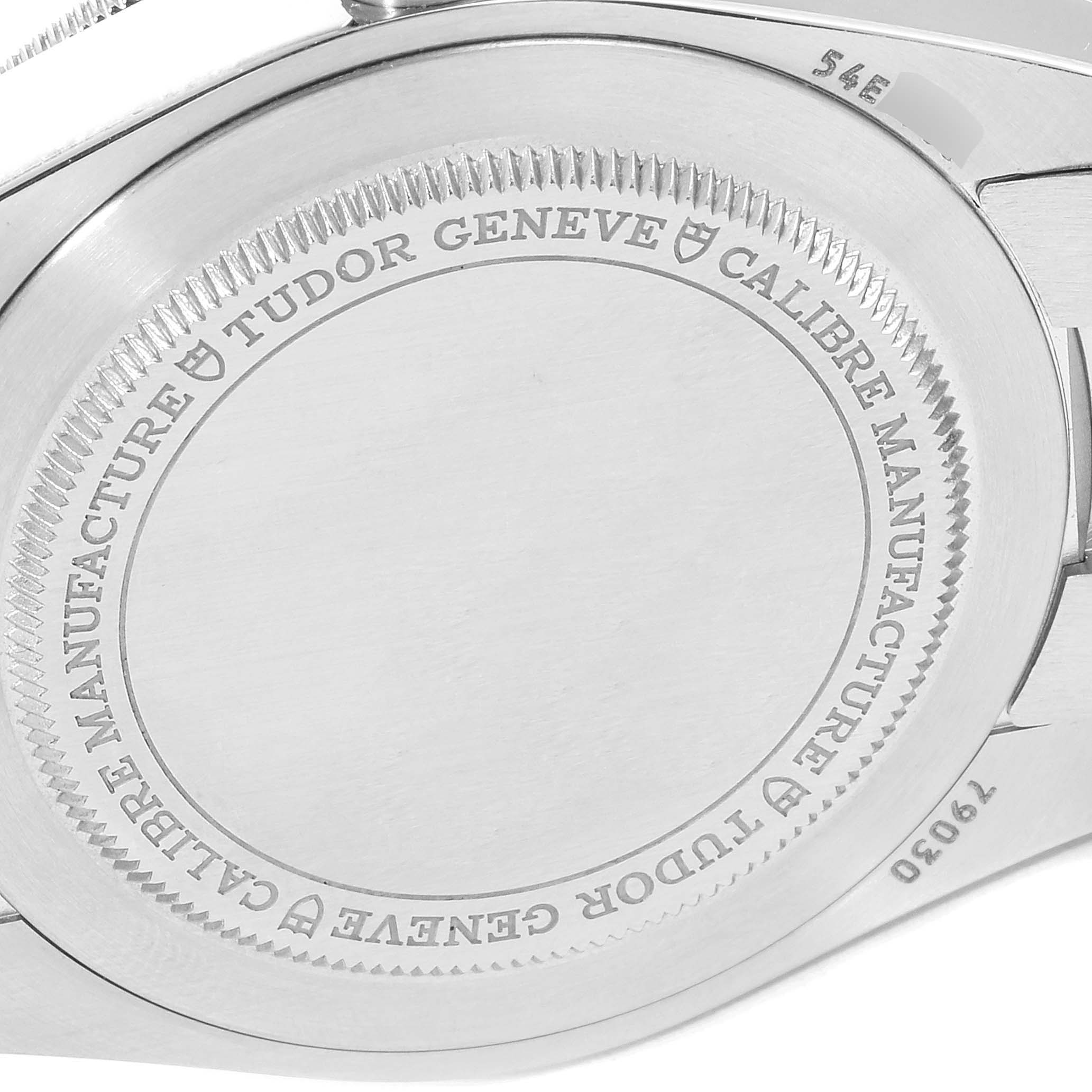 This image shows the case back of the Tudor Heritage Black Bay 79030N Men
s Stainless Steel Black Dial 79030N Men
s Stainless Steel Black Dial watch, displaying engraved text and serial number.