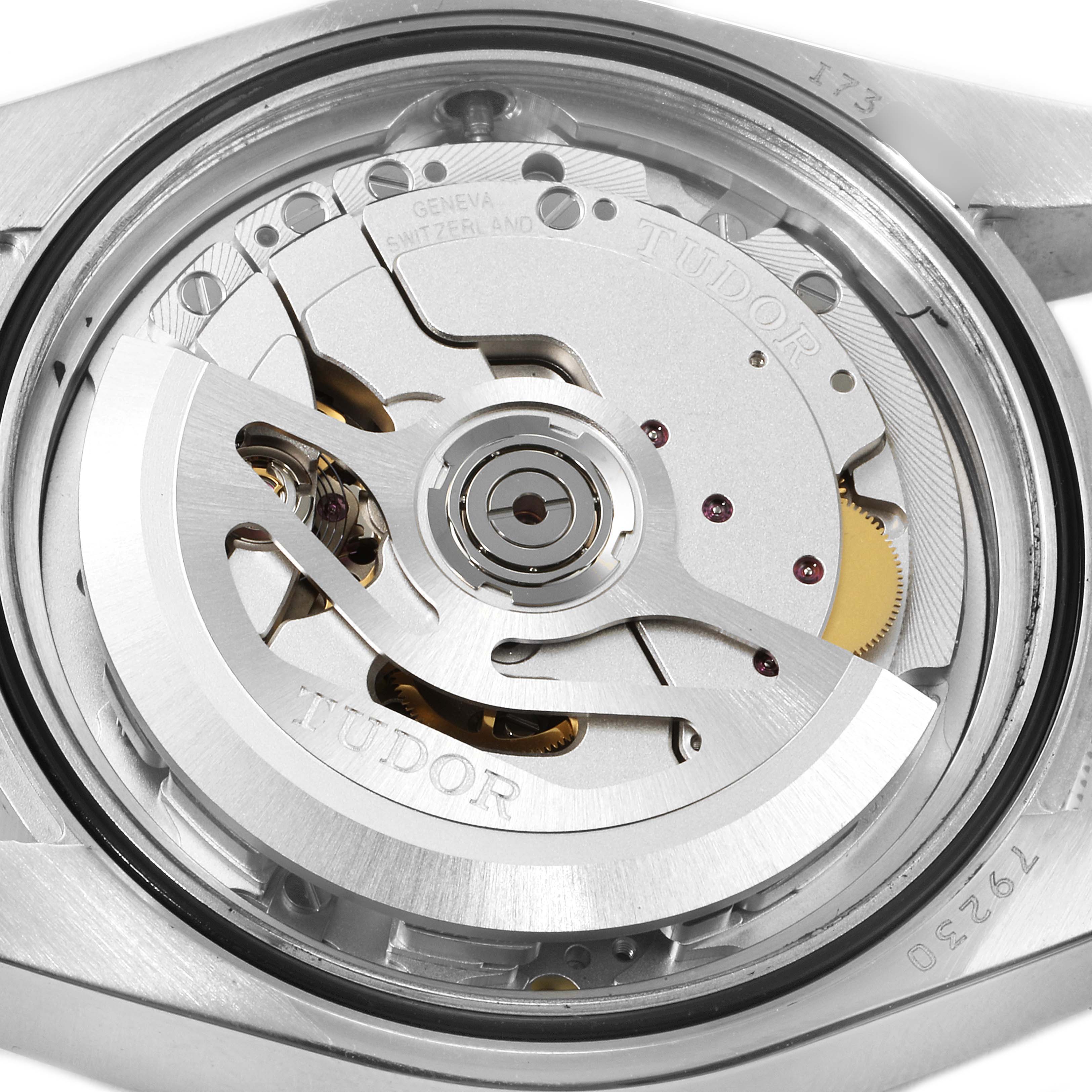 The image shows the movement mechanism of a Tudor Heritage Black Bay 79230R Men
s Stainless Steel Black Dial 79230R Men
s Stainless Steel Black Dial watch from a close-up angle.