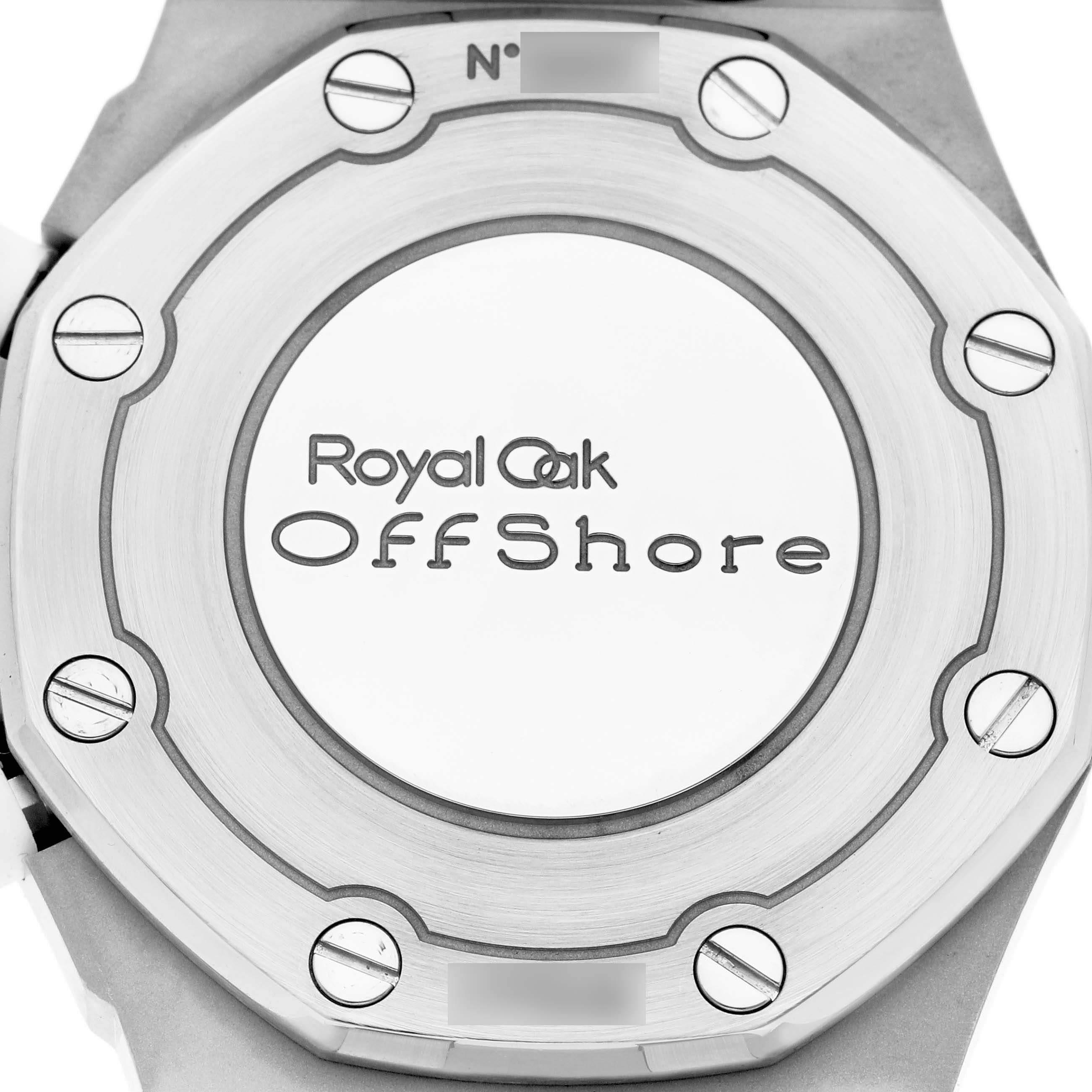 The image shows the back of a Royal Oak Offshore watch by Audemars Piguet, featuring the case back and engraved model name.