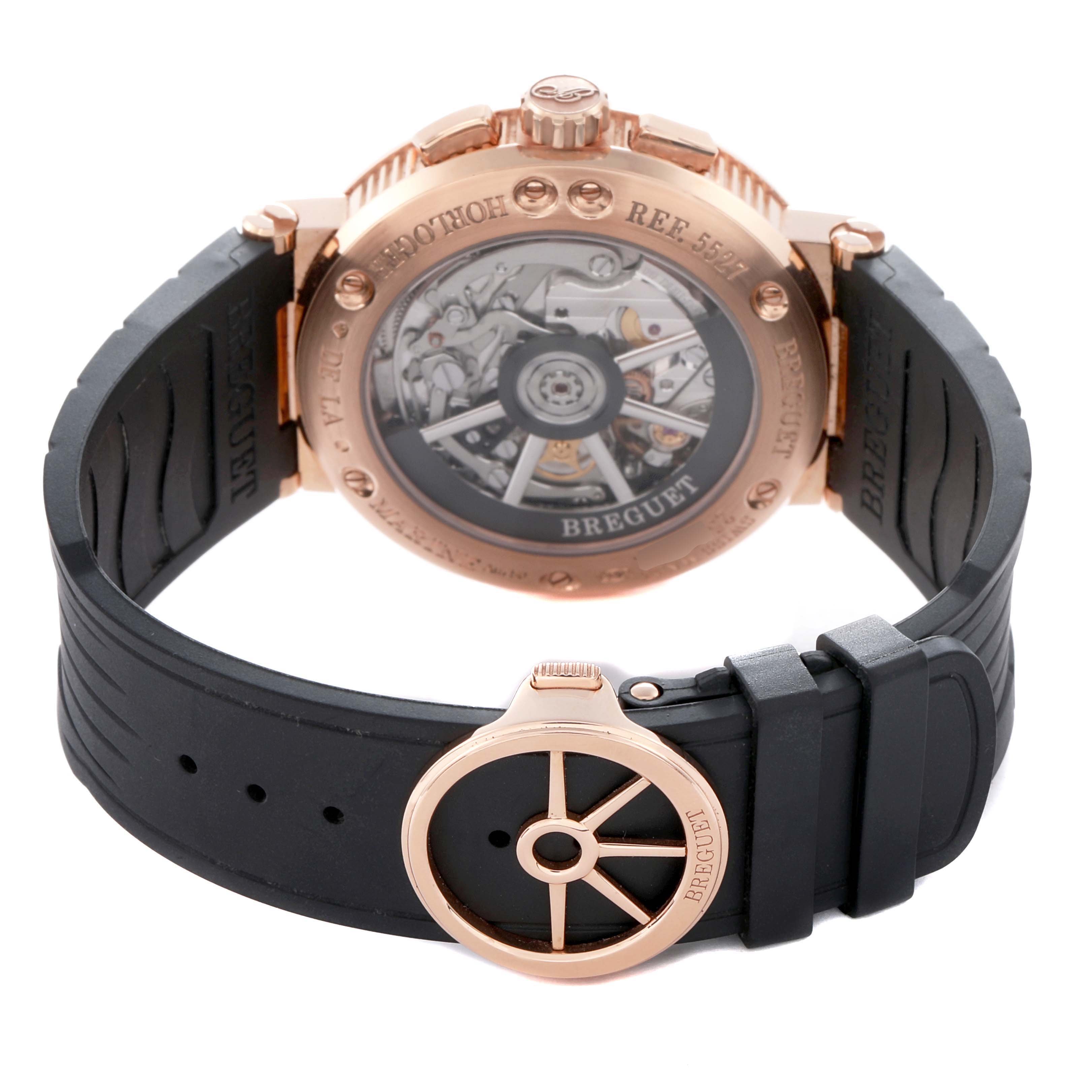 The Breguet Marine 5527BR/12/5WV Men's Rose Gold Silver Dial 5527BR/12/5WV Men's Rose Gold Silver Dial model is shown from the back, highlighting its open case back and rubber strap with a clasp detail.