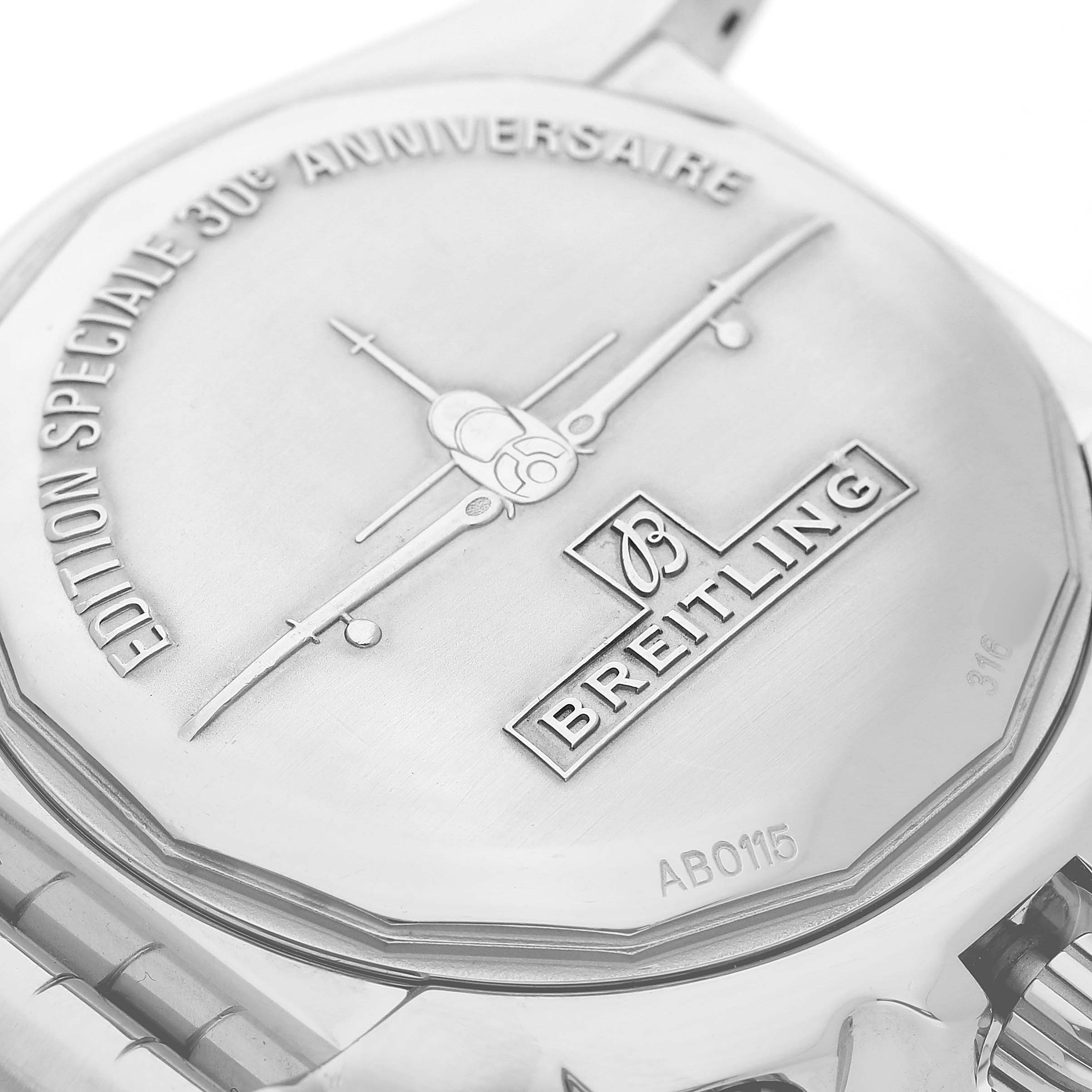 The image shows the back case of a Breitling Chronomat AB0115 Men's Stainless Steel Silver Dial watch, featuring engravings and logos.